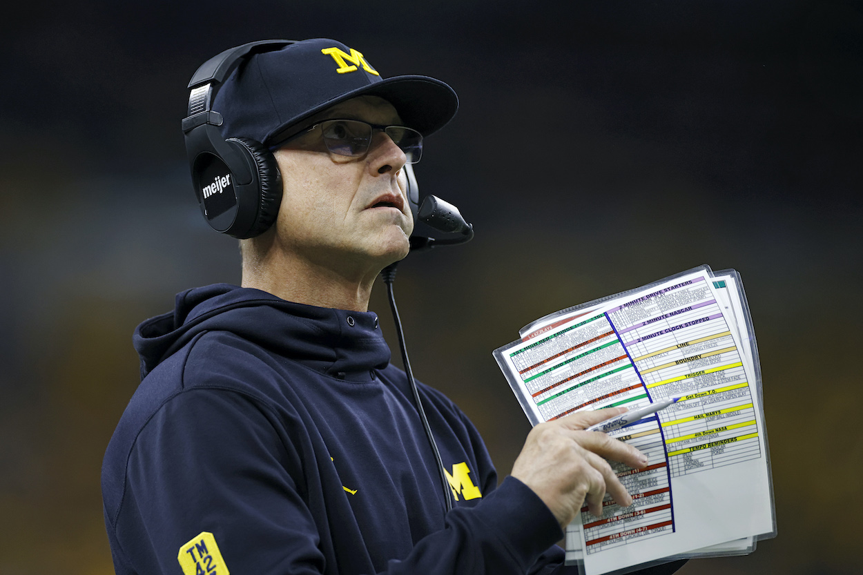 Michigan Wolverines head coach Jim Harbaugh, who recently interviewed for the Minnesota Vikings job, looks on from the sideline during the Big Ten Championship college football game against the Iowa Hawkeyes on Dec. 4, 2021 at Lucas Oil Stadium in Indianapolis, Indiana.