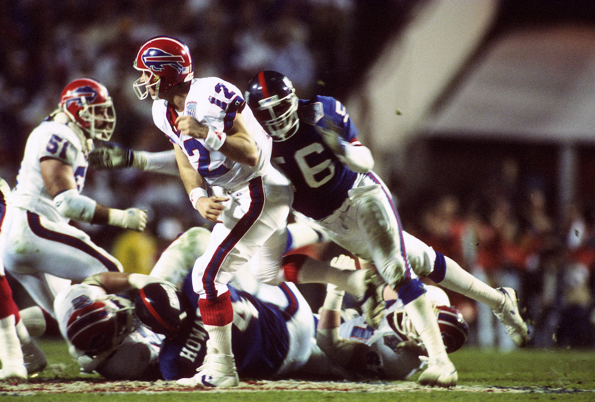 Jim Kelly throws under pressure during Super Bowl XXV, which became the first of four Super Bowl losses for the Buffalo Bills