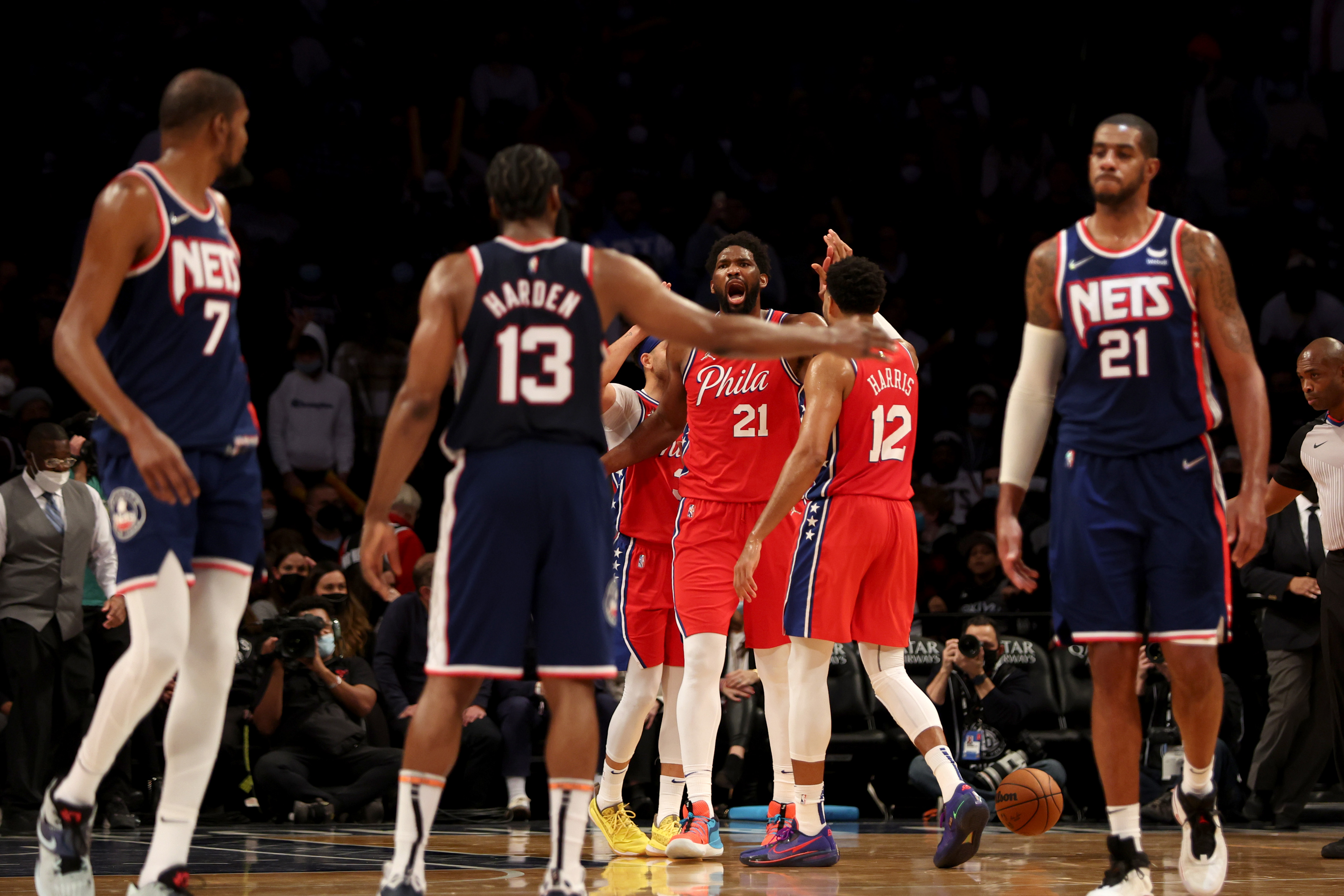 Philadelphia 76ers center Joel Embiid yells at #13 James Harden and other members of the Brooklyn Nets