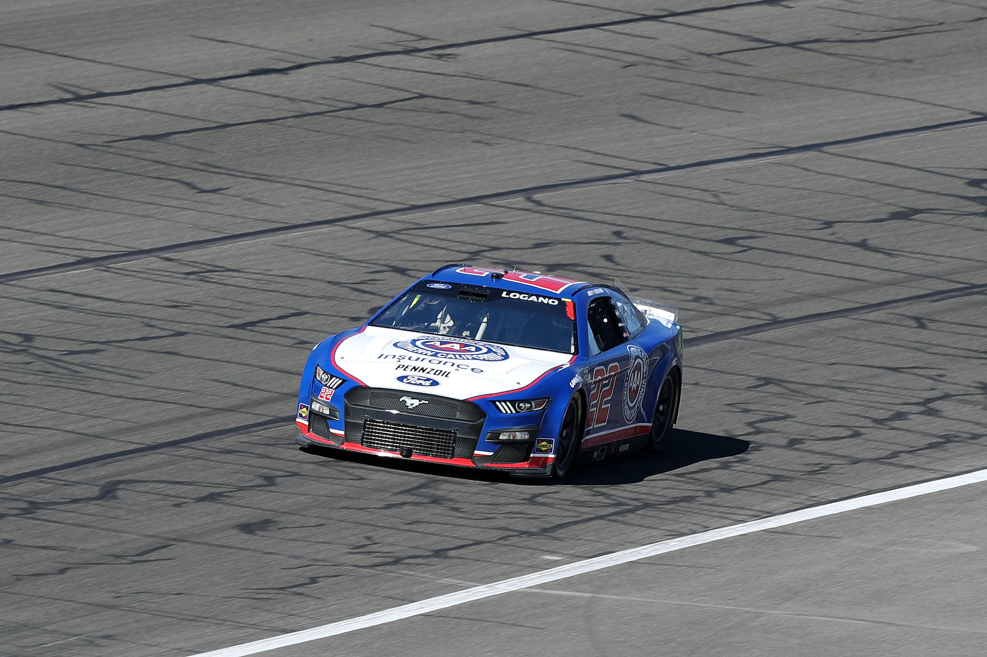 Joey Logano drives during qualifying