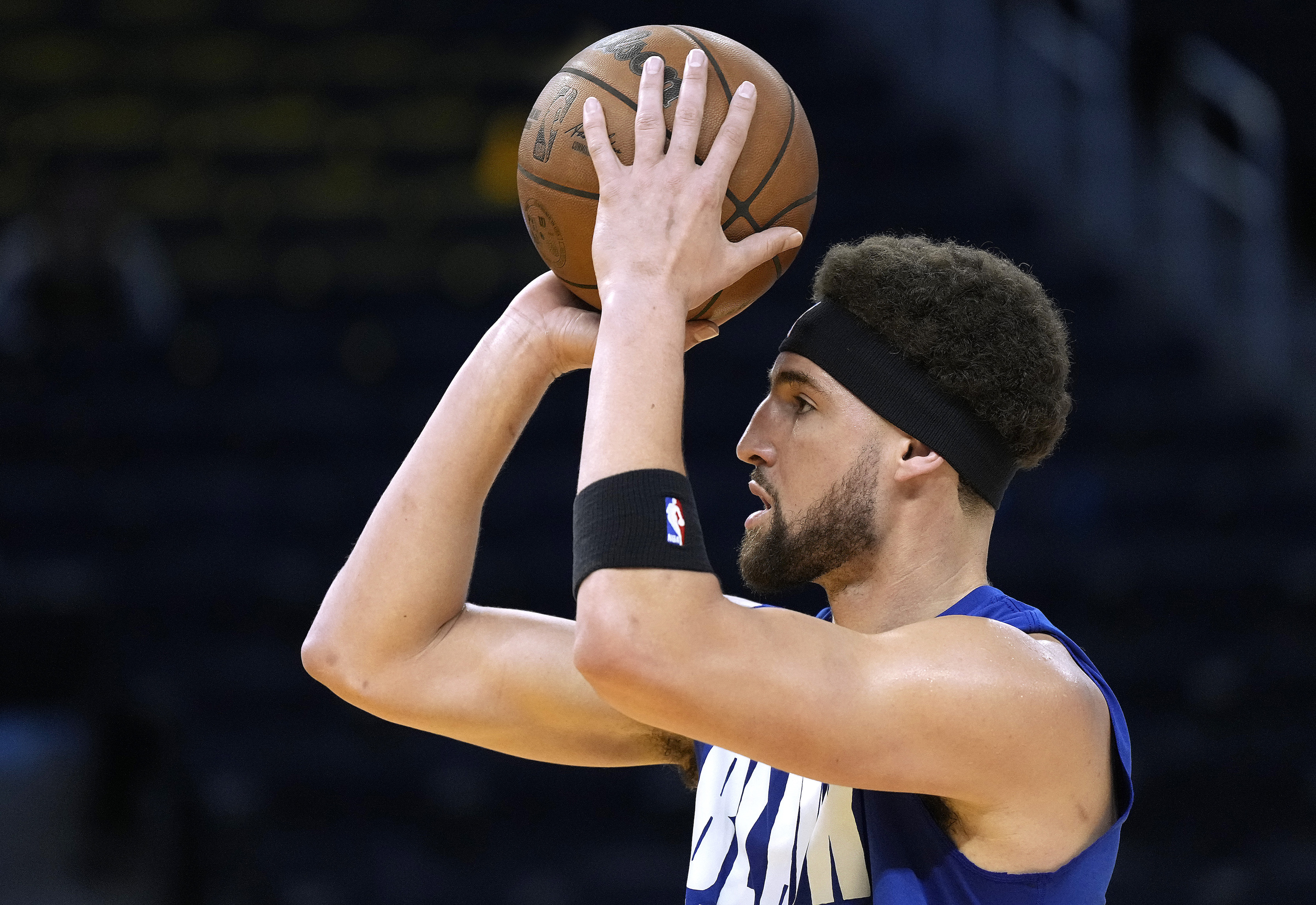 Golden State Warriors guard Klay Thompson warms up before an NBA game against the Denver Nuggets in February 2022