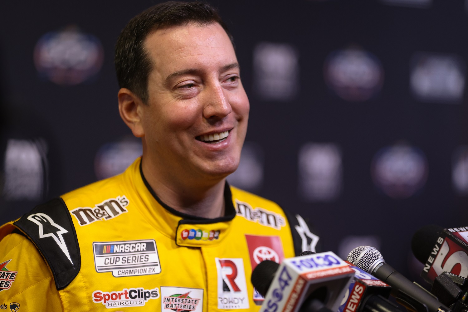 Kyle Busch, driver of the No. 18 Toyota, speaks to the media during the NASCAR Cup Series Daytona 500 Media Day.