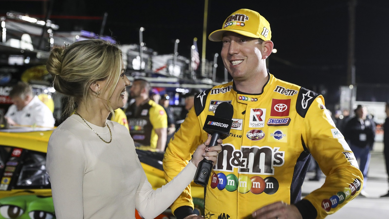 Kyle Busch, driver of the No. 18 Toyota, speaks with a reporter following qualifying for the NASCAR Cup Series Busch Light Clash at Los Angeles Memorial Coliseum on Feb. 5, 2022.