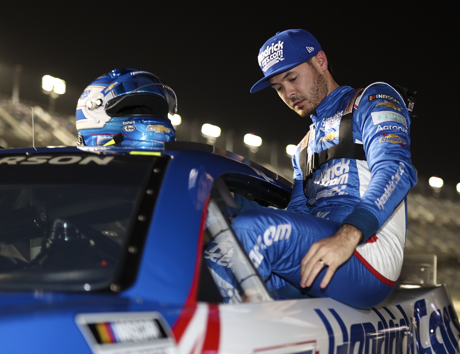 Kyle Larson exits the No. 5 Chevy after qualifying in the pole position for the 64th Daytona 500 at Daytona International Speedway on Feb. 16, 2022. | James Gilbert/Getty Images