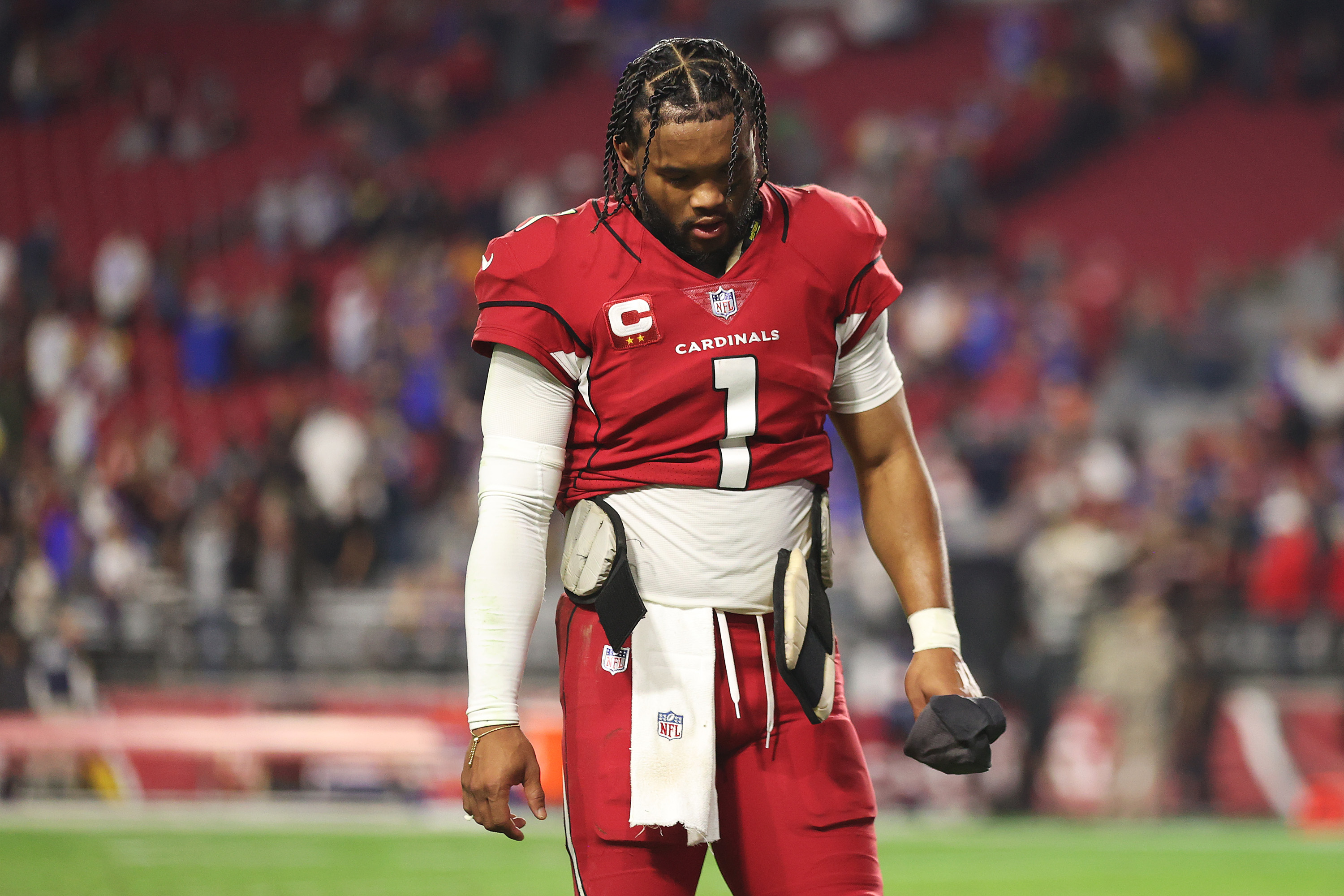 Cardinals QB Kyler Murray walks off the field after loss to the Rams