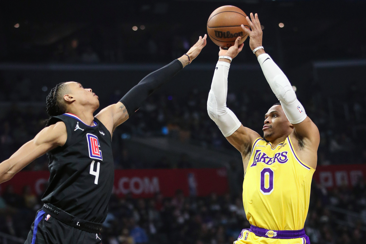 Los Angeles Lakers guard Russell Westbrook attempts to shoot Los Angeles Clippers guard Brandon Boston Jr. in the first half at Crypto.com Arena on February 03, 2022 in Los Angeles, California.