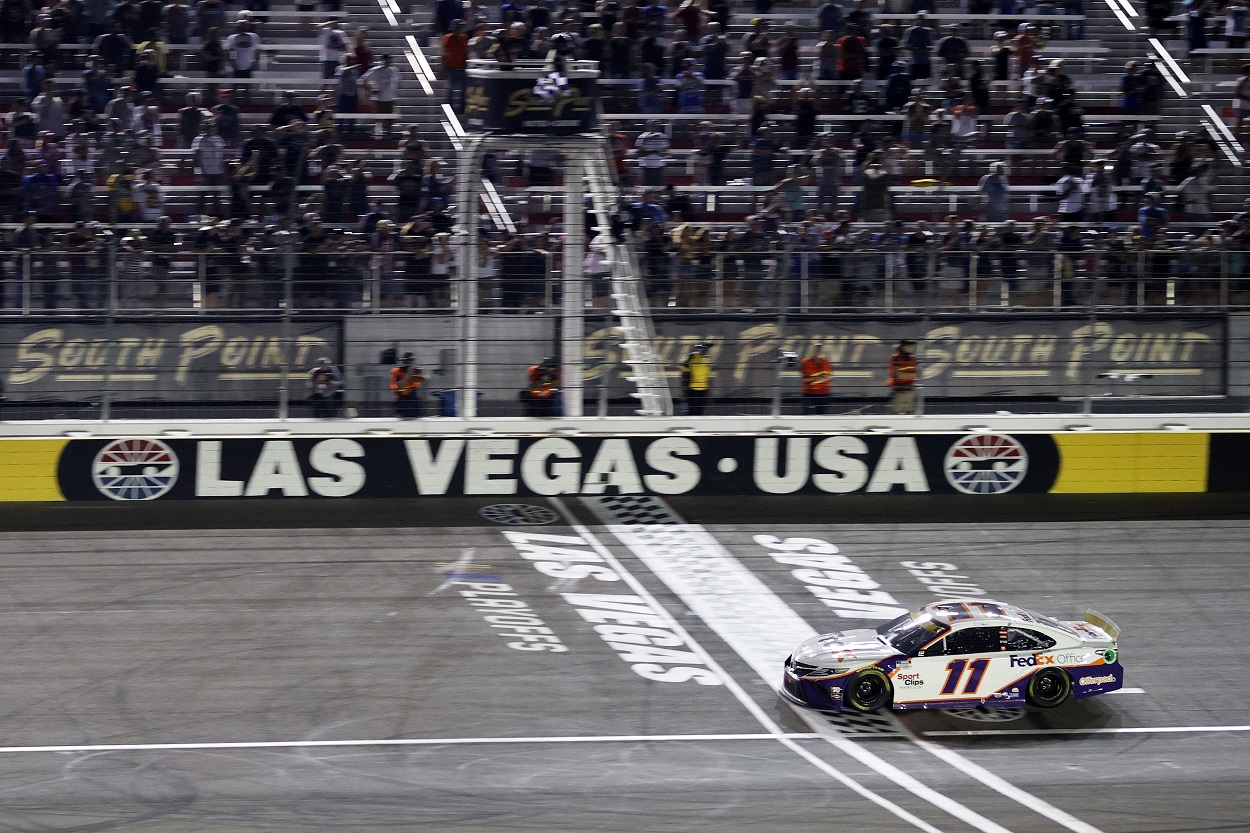 Denny Hamlin crosses the finish line at Las Vegas Motor Speedway to win NASCAR Cup Series South Point 400