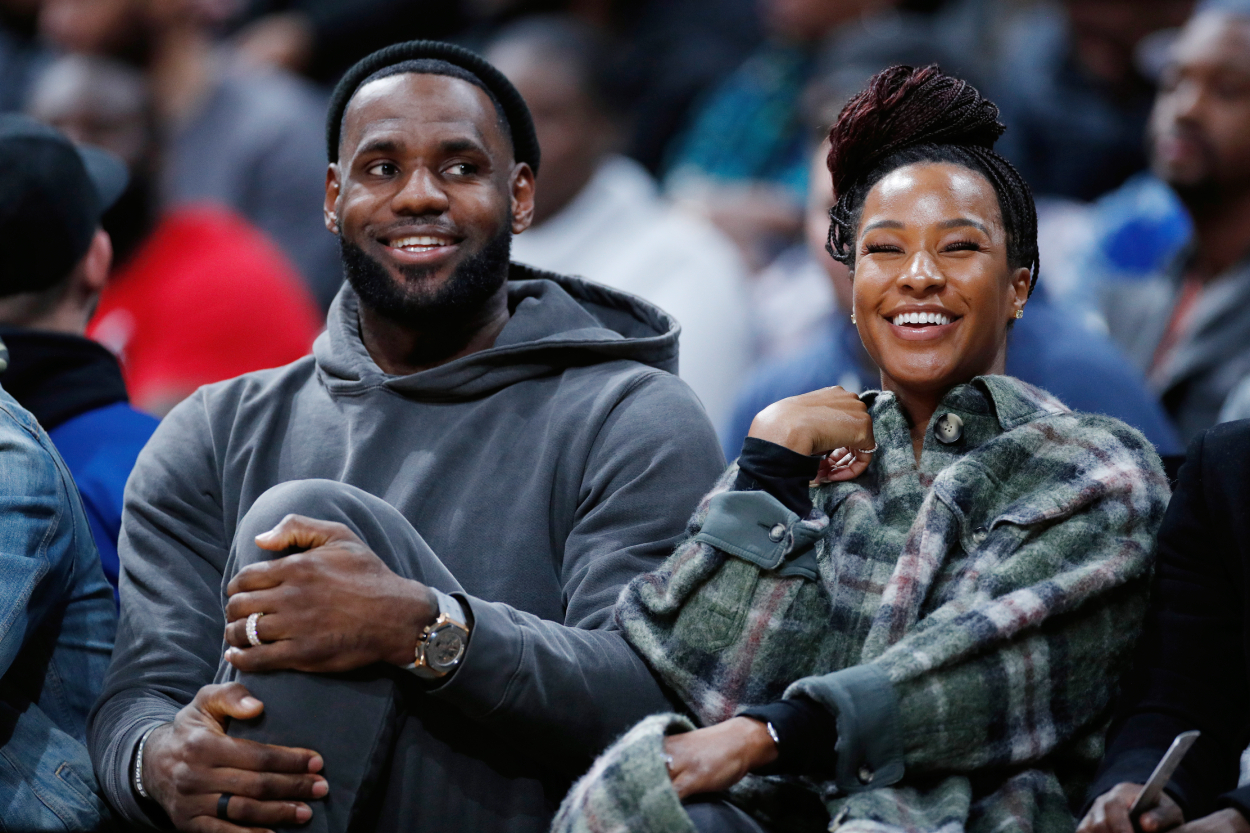 LeBron James and his wife Savannah during a high school game in December 2019.