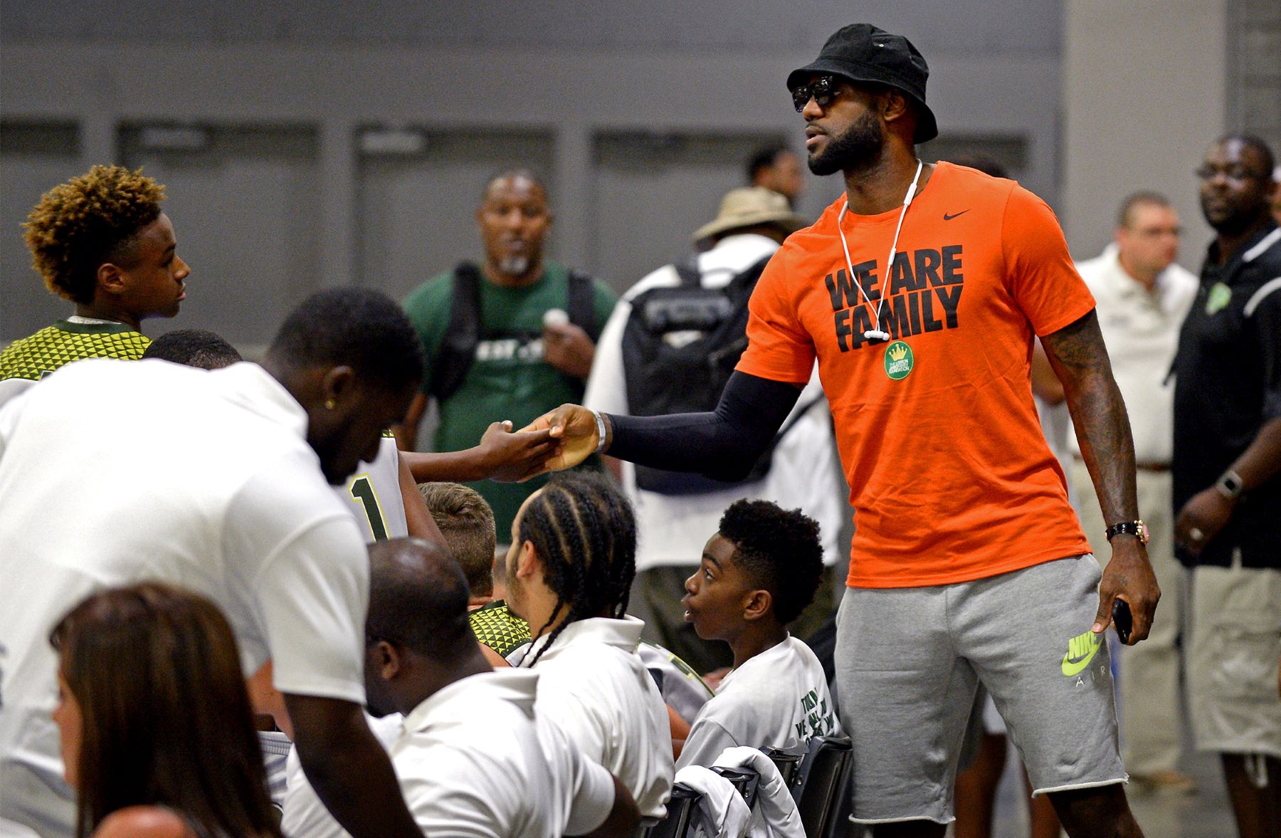 LeBron James being a father to his son LeBron James Jr. at a youth tournament game, absent Anthony McClelland