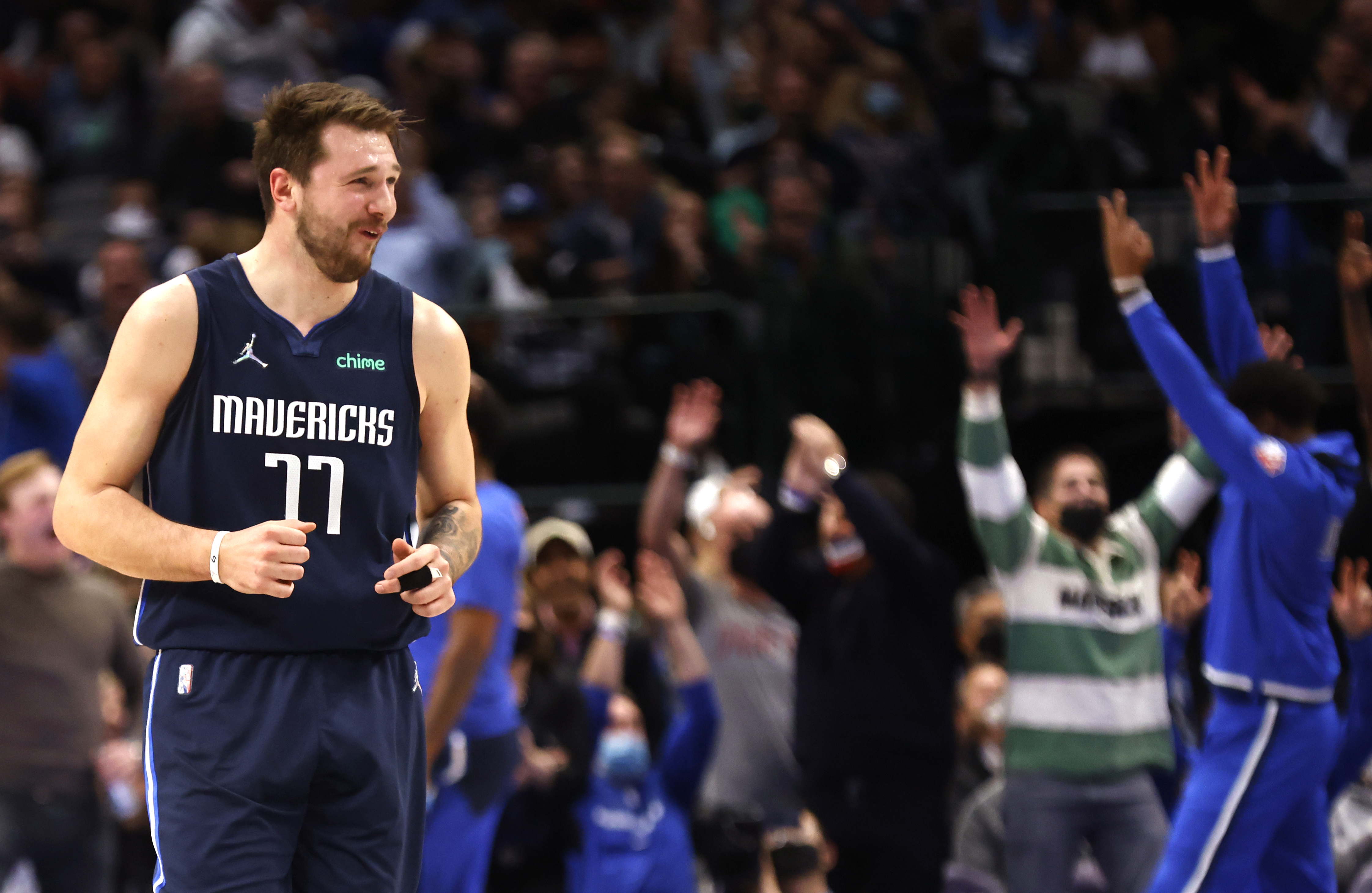 Dallas Mavericks star Luka Doncic reacts to a three-point basket during an NBA game against the Los Angeles Clippers in February 2022
