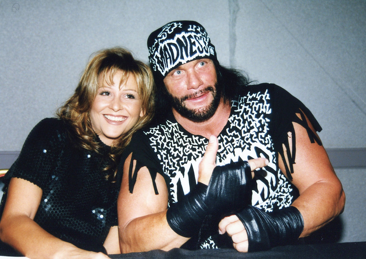 'Macho Man' Randy Savage and Miss Elizabeth lean into each other and smile for the cameras in 1998