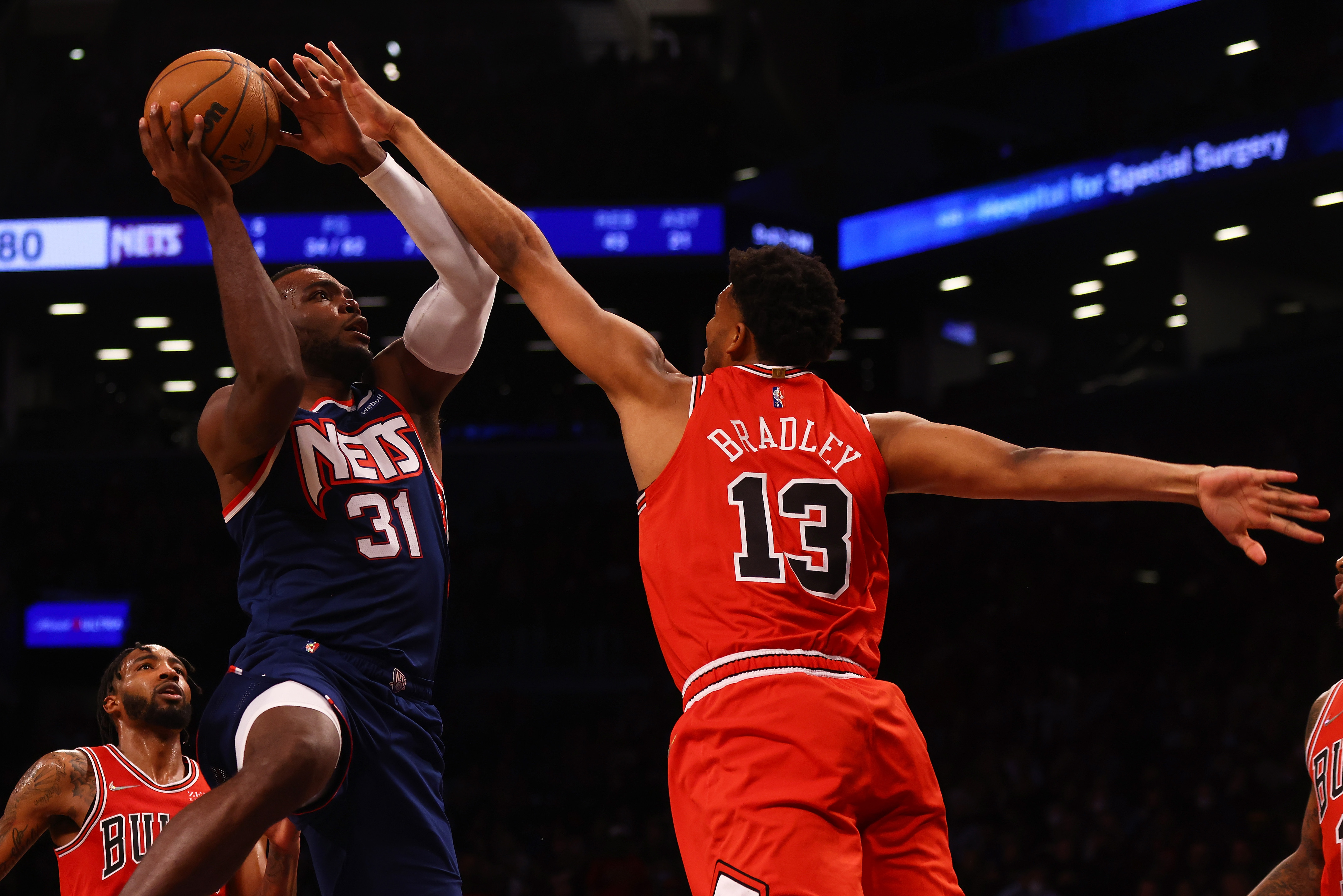 Brooklyn Nets forward Paul Millsap shoots over Chicago Bulls center Tony Bradley during an NBA game in December 2021