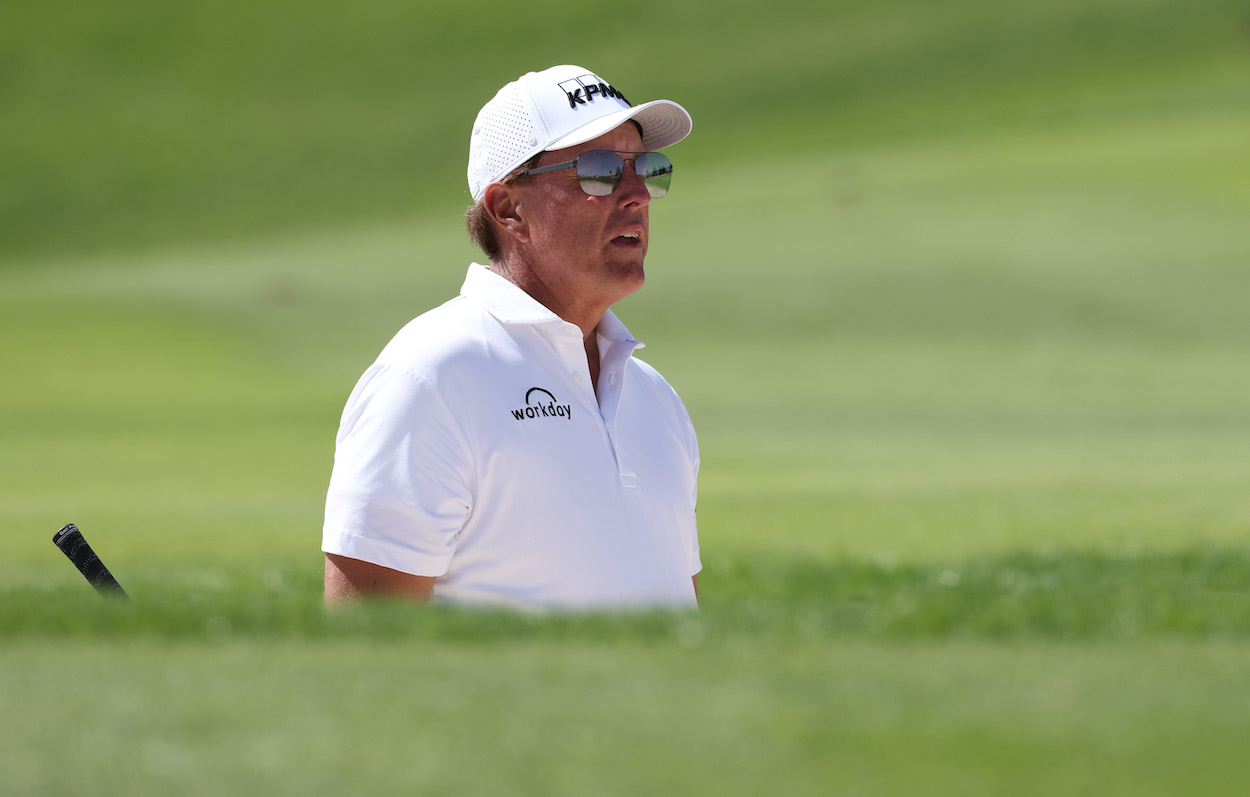 Phil Mickelson of USA looks on after playing from a bunker on the 10th hole during day three of the PIF Saudi International at Royal Greens Golf & Country Club on February 05, 2022 in Al Murooj, Saudi Arabia.