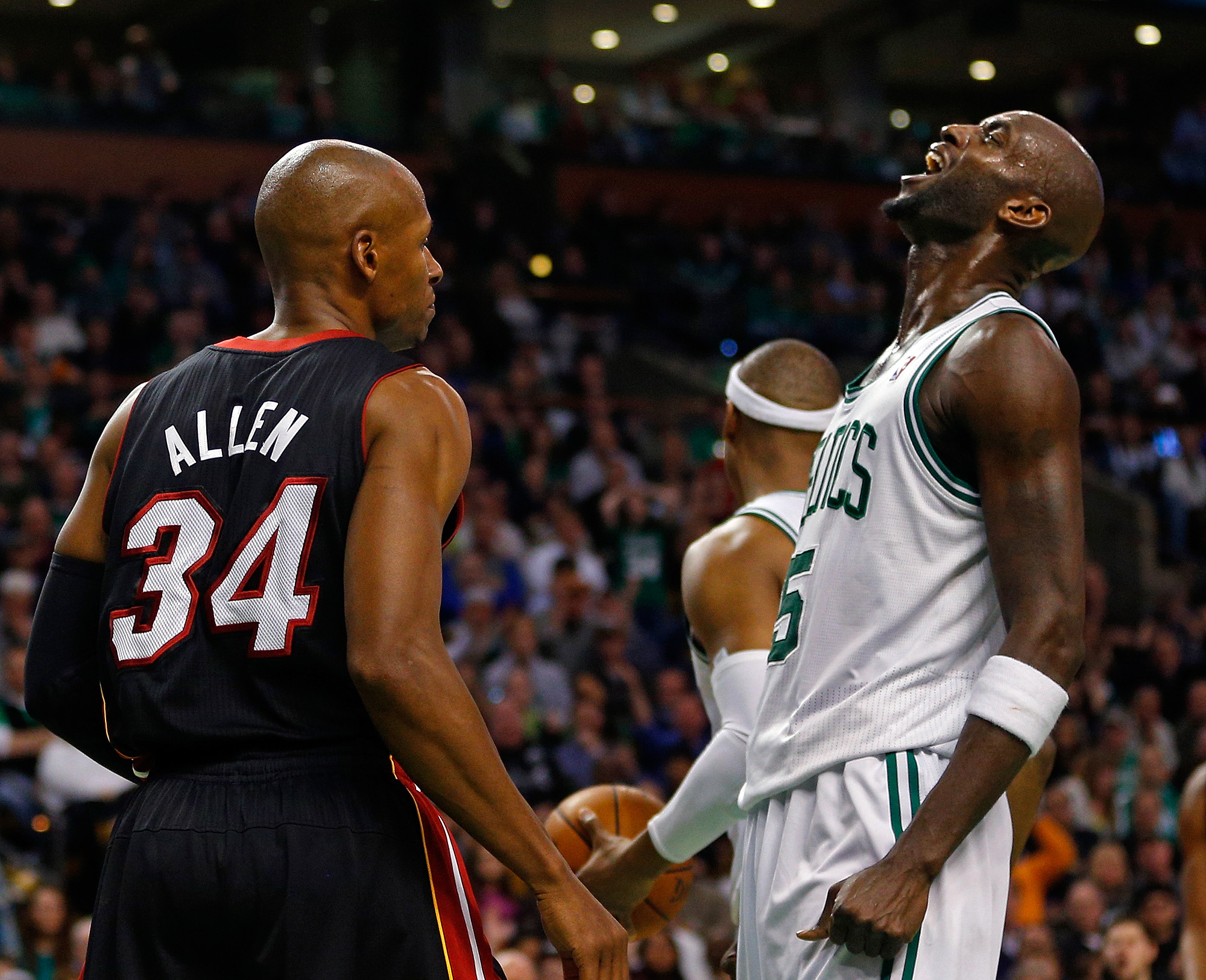Boston Celtics power forward Kevin Garnett, right, reacts after being called for a foul against Miami Heat shooting guard Ray Allen.
