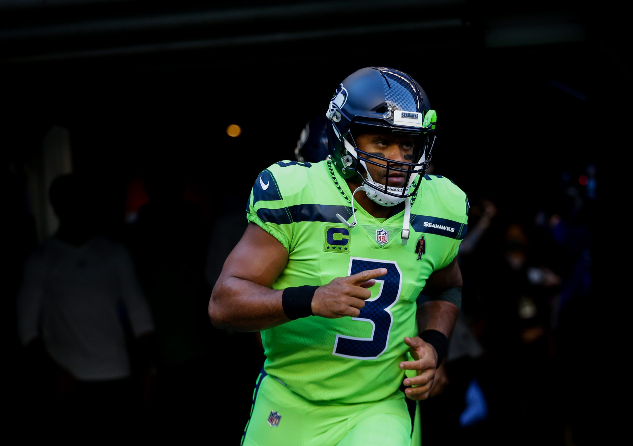 Quarterback Russell Wilson of the Seattle Seahawks runs out for the game against the Los Angeles Rams at Lumen Field on October 7, 2021 in Seattle, Washington. The Russell Wilson contract makes it much easier to trade the QB this offseason.