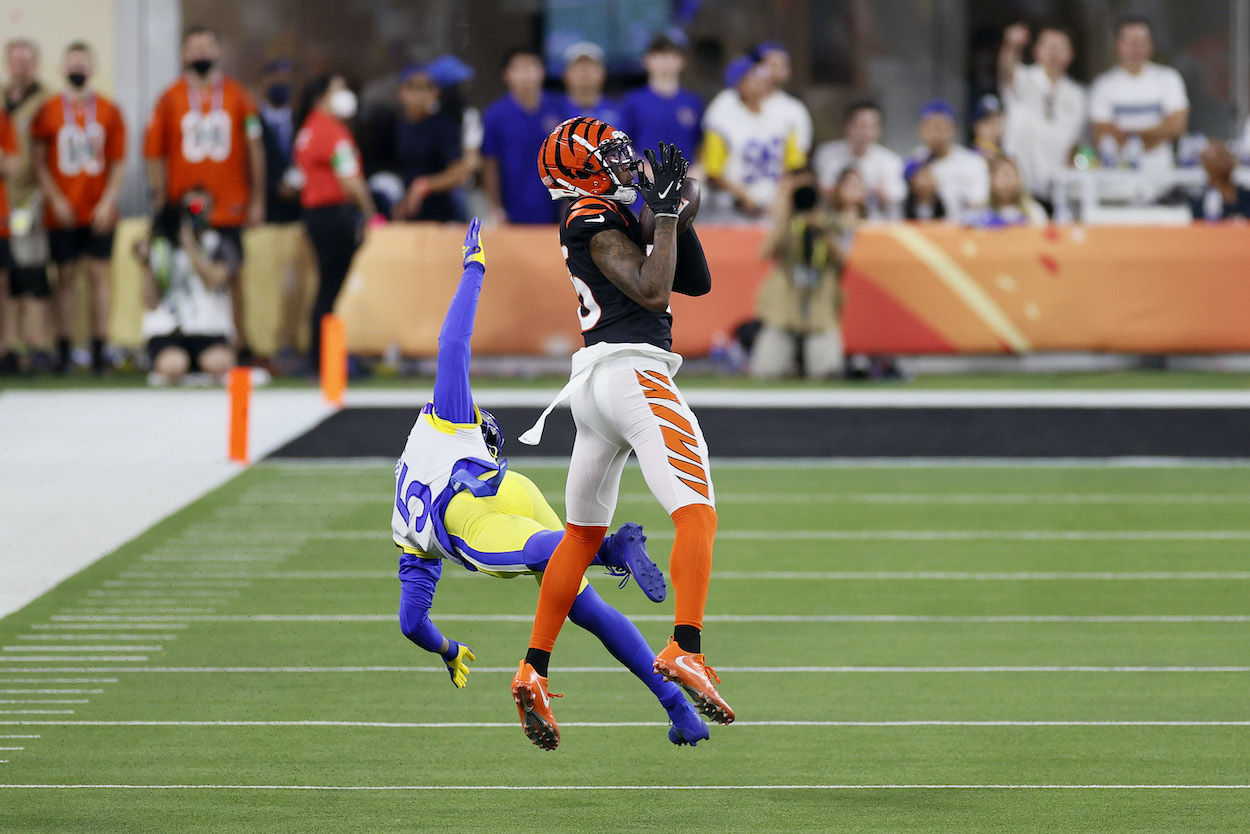 Tee Higgins of the Cincinnati Bengals catches the ball over Jalen Ramsey of the Los Angeles Rams for a touchdown in the third quarter during Super Bowl LVI at SoFi Stadium on February 13, 2022 in Inglewood, California. The play was a missed call by referee Ron Torbert's crew.