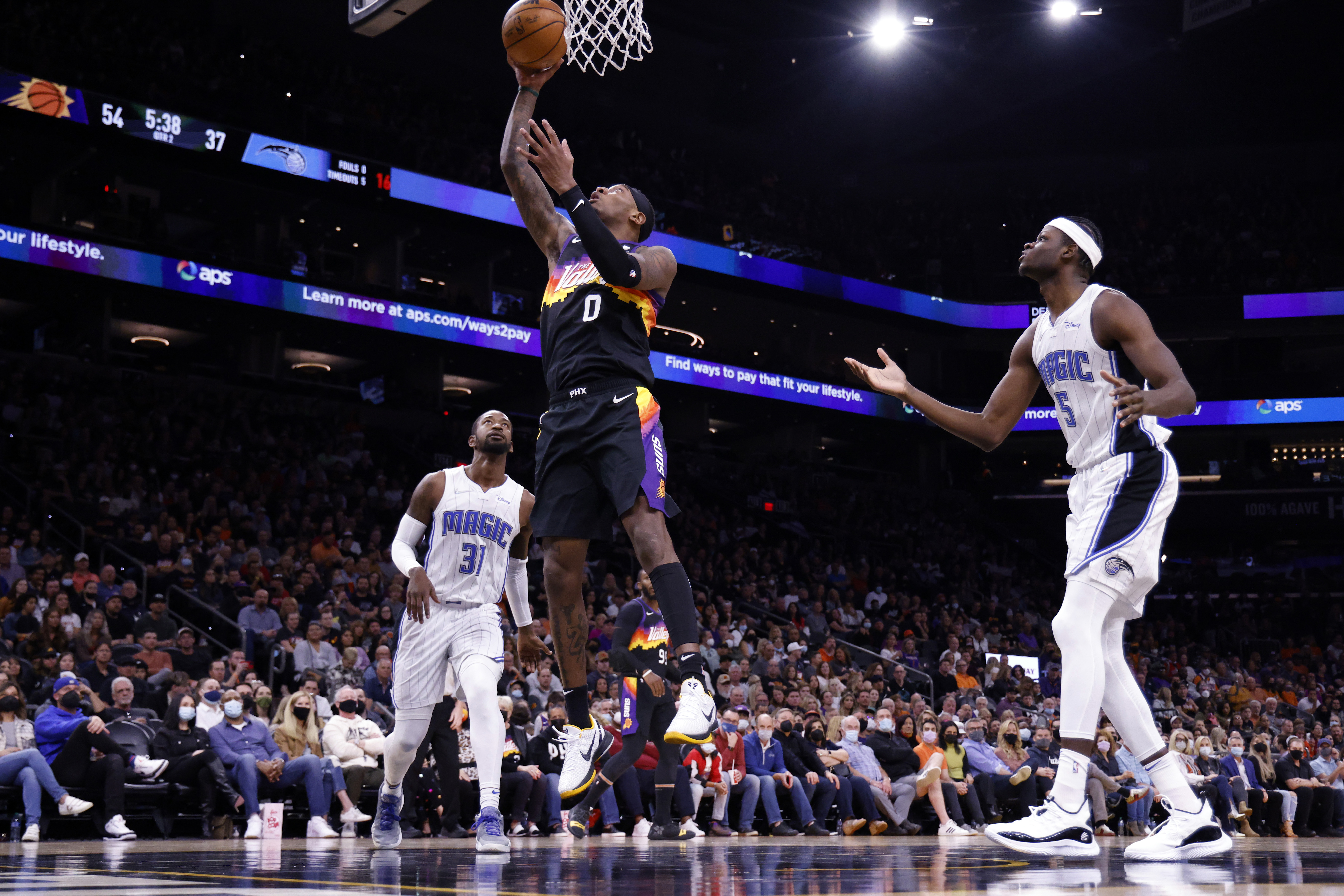 Phoenix Suns forward Torrey Craig shoots a layup during an NBA game against the Orlando Magic