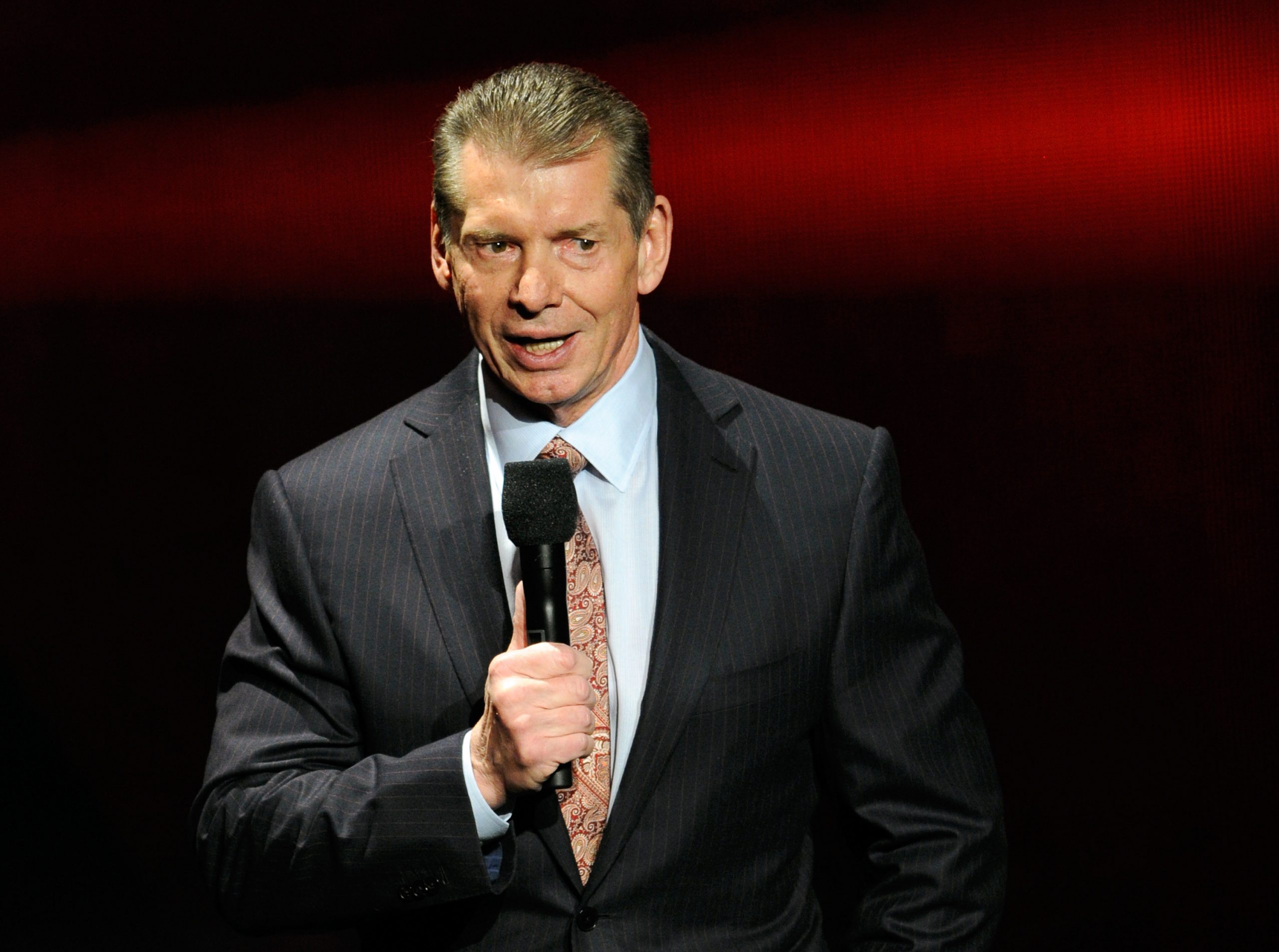 WWE Chairman and CEO Vince McMahon speaks at a news conference.