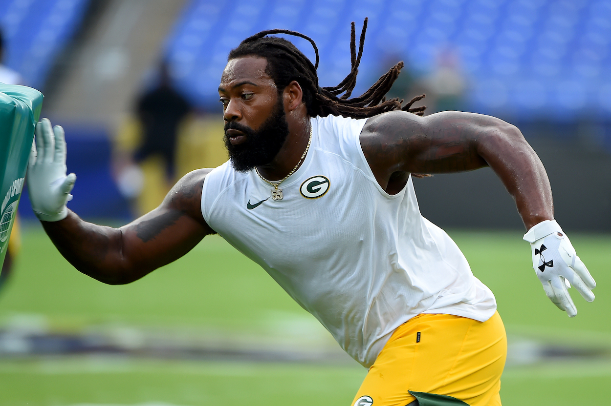 Packers defensive end Za'Darius Smith warms up before facing the Ravens
