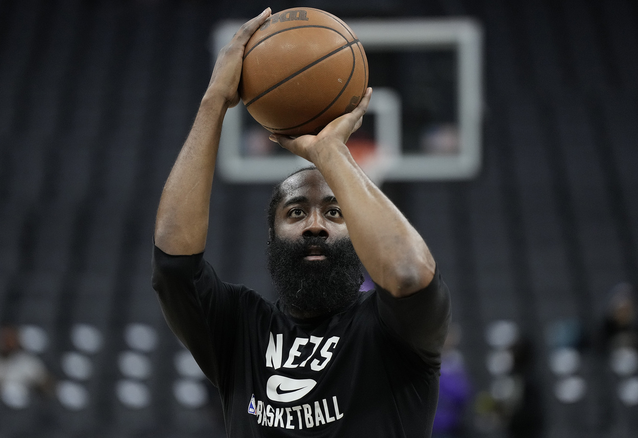 Brooklyn Nets guard James Harden shoots during warmups.