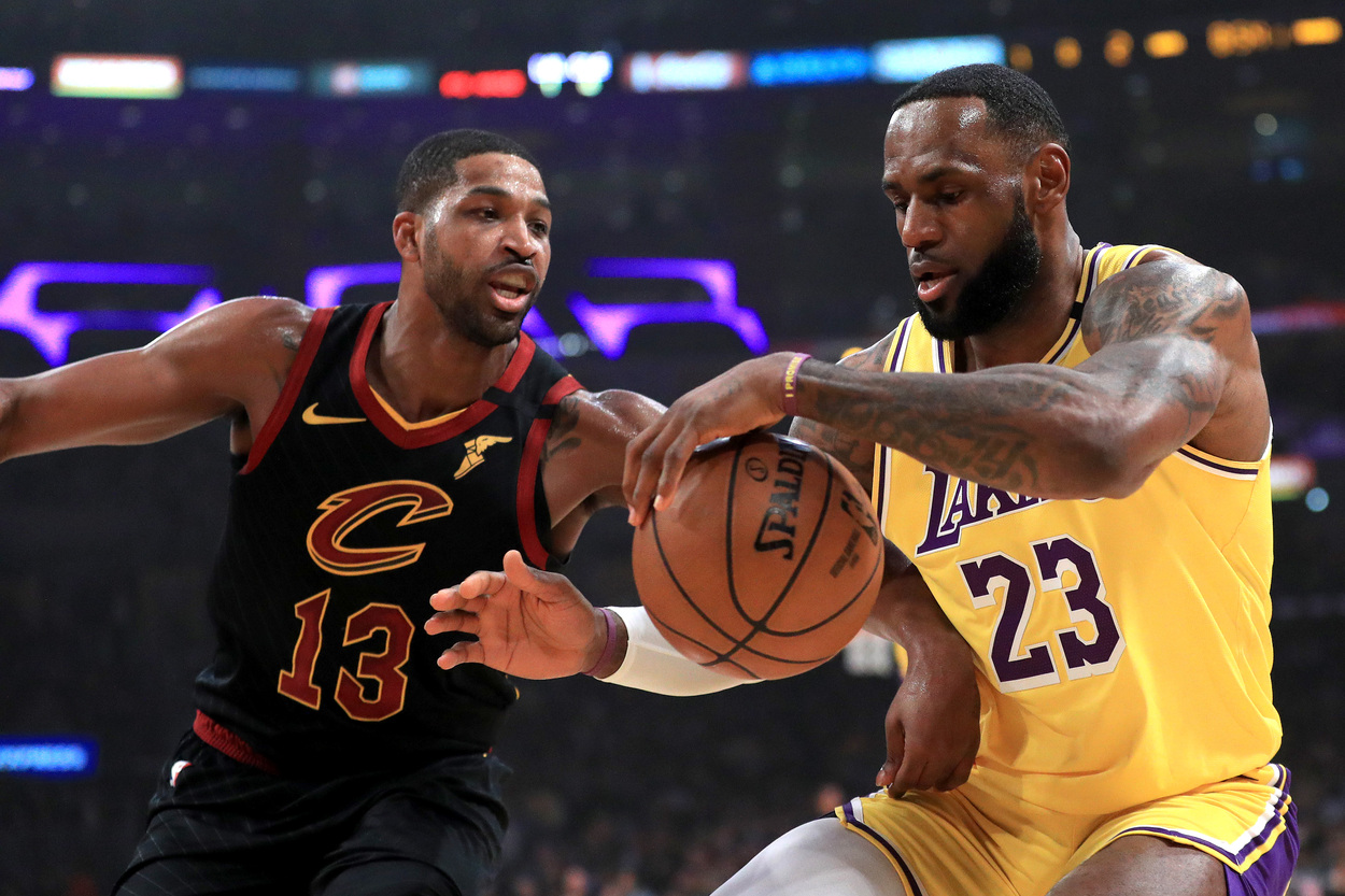 Los Angeles Lakers star LeBron James keeps the ball away from Tristan Thompson.
