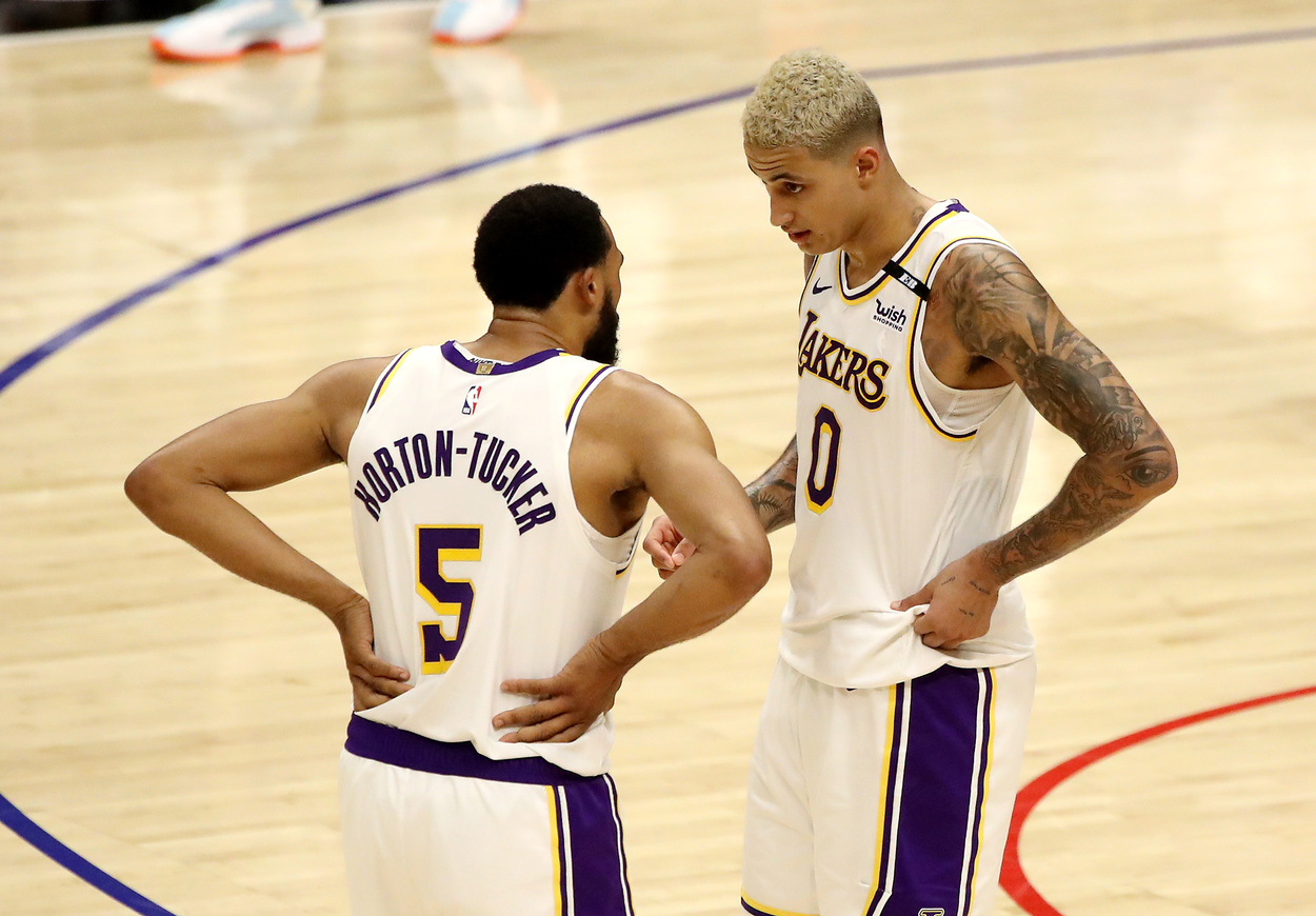 Talen Horton-Tucker and Kyle Kuzma chat on the court.