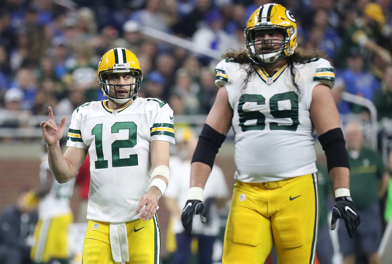 Green Bay Packers Aaron Rodgers (L) and David Bakhtiari on the field. Rodgers officiated Bakhtiari's wedding in Saturday, March 5, 2022.