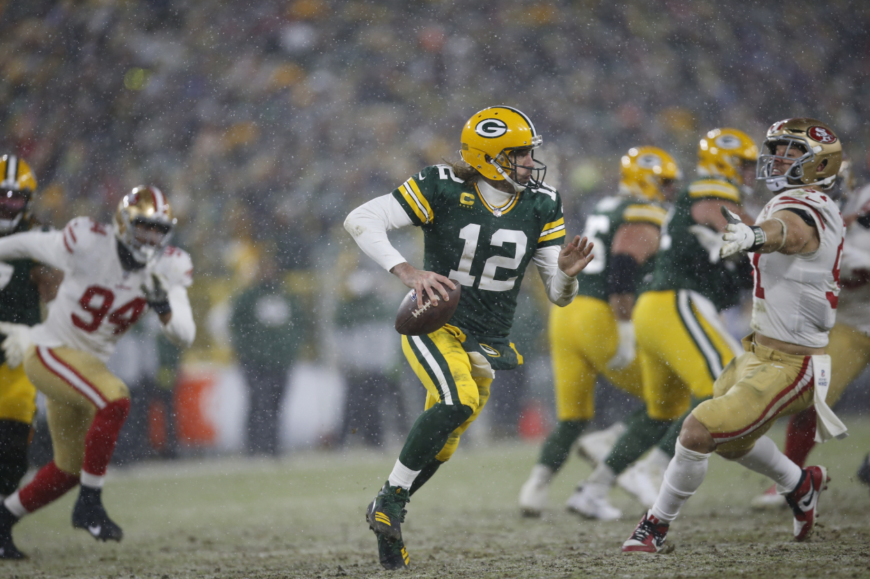 Aaron Rodgers of the Green Bay Packers scrambles during the game against the San Francisco 49ers.