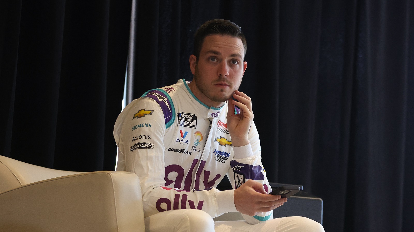 Alex Bowman, driver of the No. 48 Chevrolet, waits to speak to the media during the NASCAR Cup Series Daytona 500 Media Day.