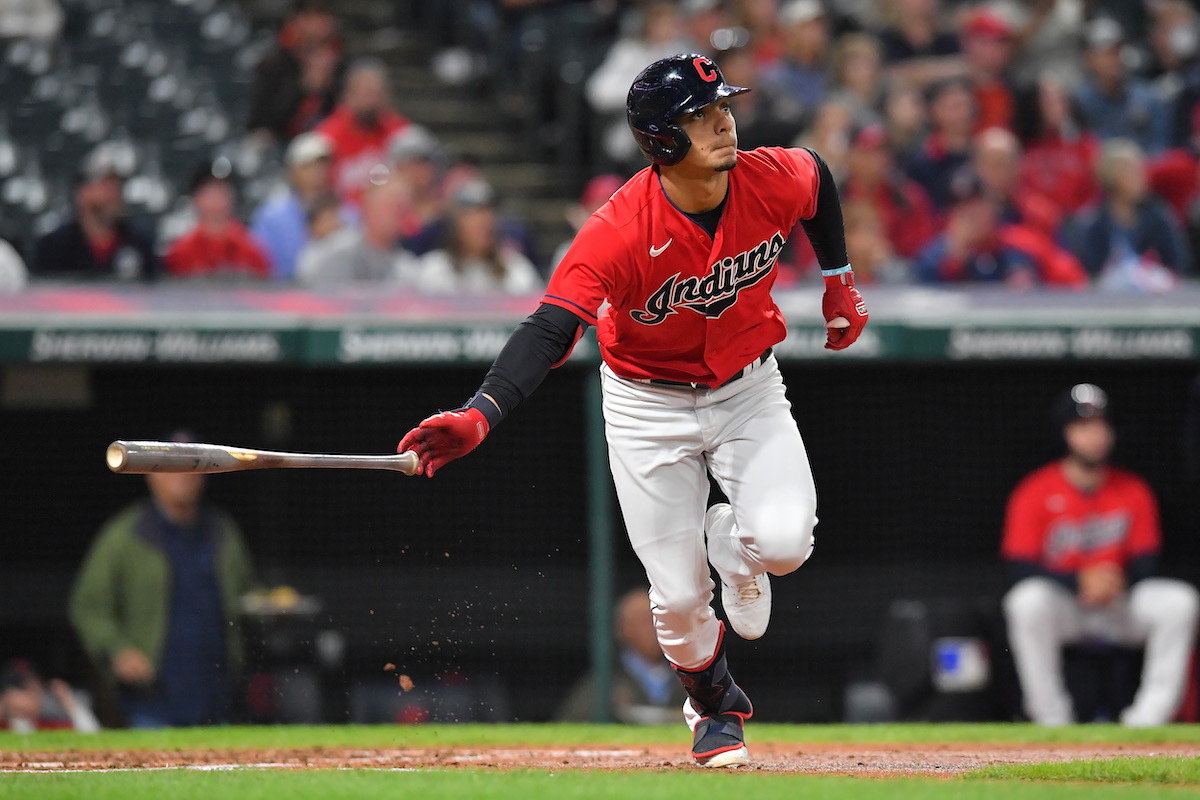 Andres Gimenez tosses his bat after hitting a homer for Cleveland.