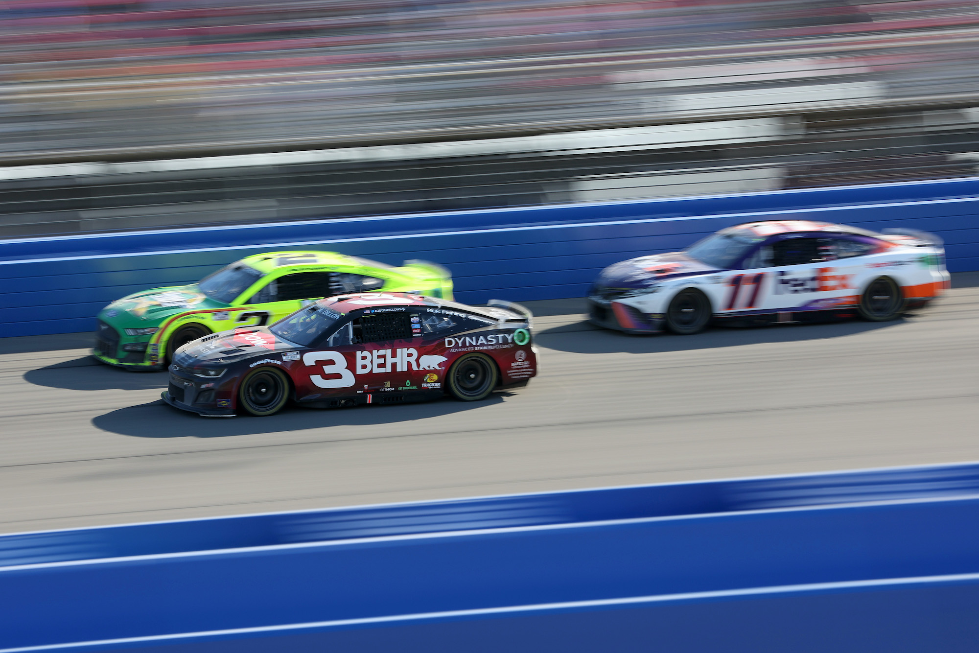 Austin Dillon races Austin Cindric and Denny Hamlin