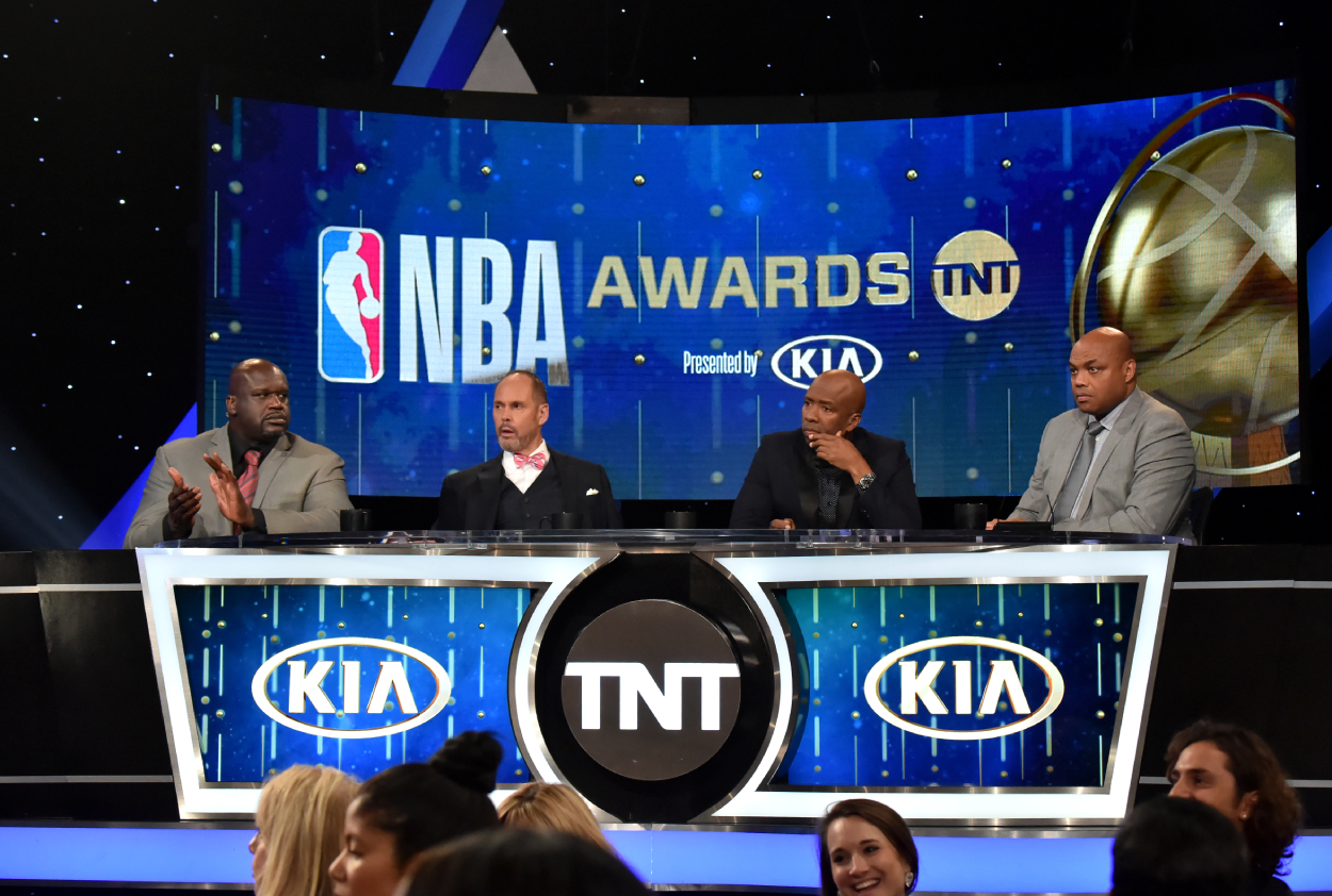 (L-R) Shaquille O'Neal, Ernie Johnson Jr., Kenny Smith, and Charles Barkley speak onstage.