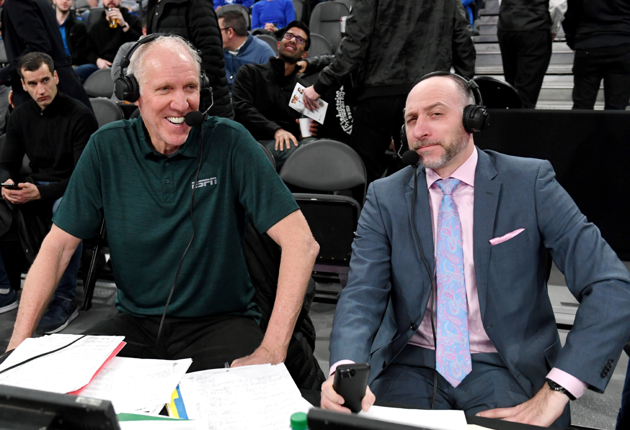 Sportscaster and former NBA player Bill Walton (L) and sportscaster Dave Pasch talk before a game.