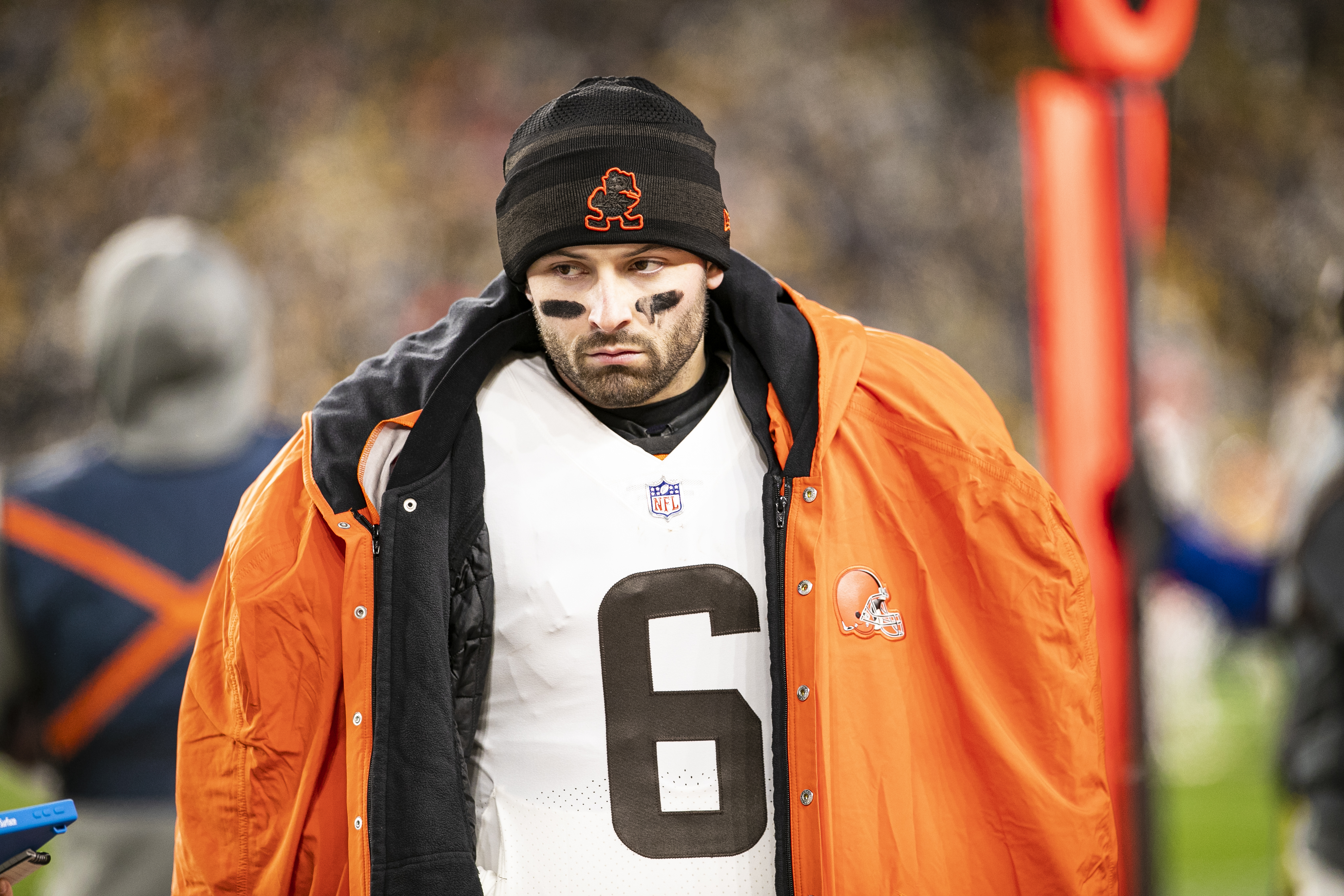 Cleveland Browns quarterback Baker Mayfield looks on form the sideline during an NFL game.