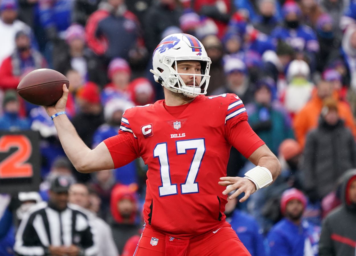 Buffalo Bills Josh Allen attempts to a make a pass during an NFL game.