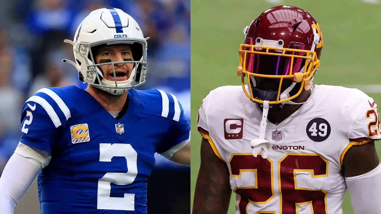 Colts QB Carson Wentz calls a play; Commanders safety Landon Collins walk off field before a game