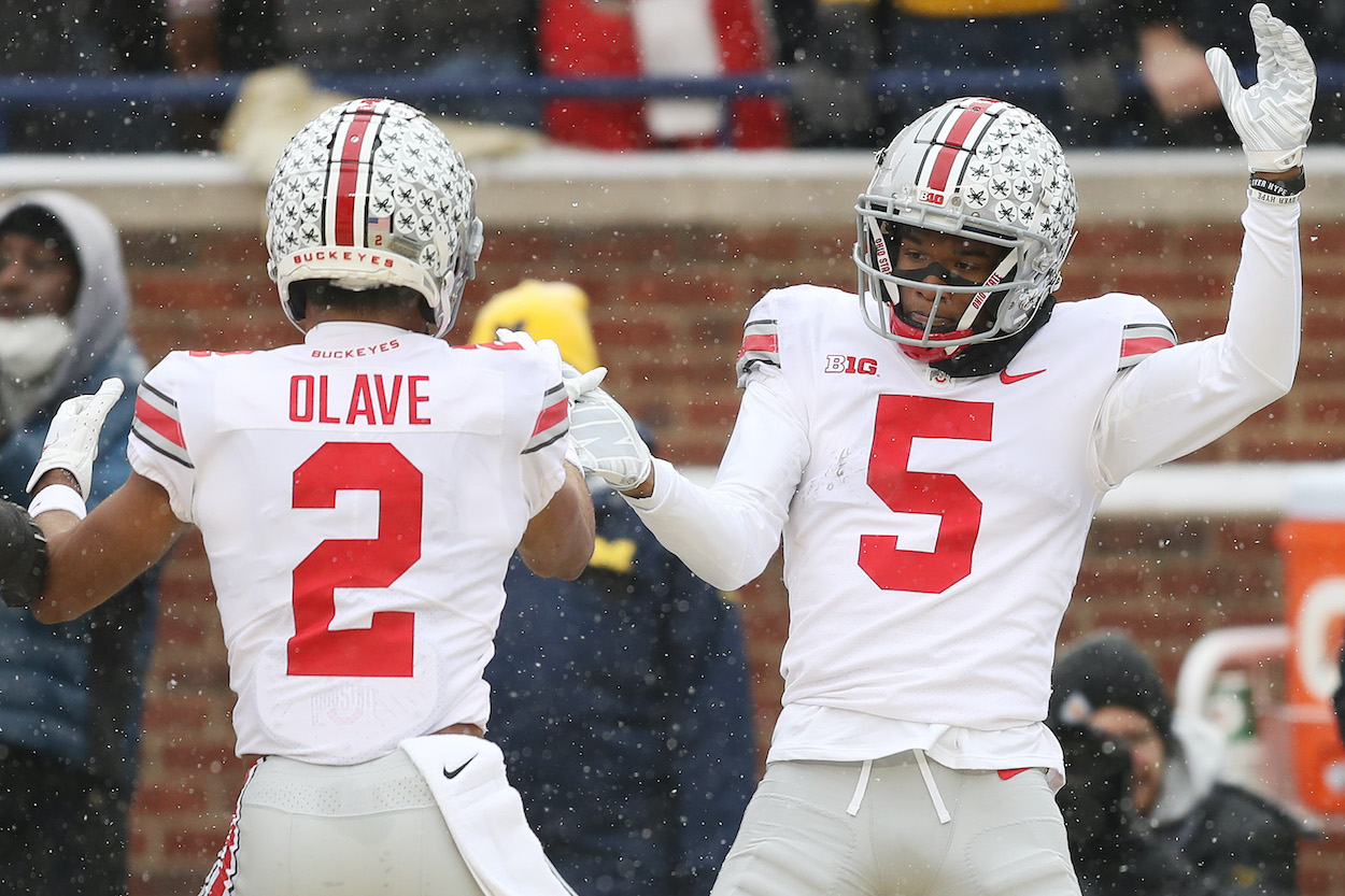 Ohio State wide receiver Chris Olave celebrates a touchdown with fellow NFL Draft prospect Garrett Wilson.