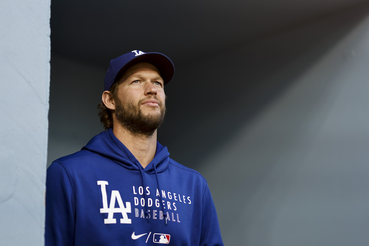 Los Angeles Dodgers pitcher Clayton Kershaw stands in the dugout before a game.