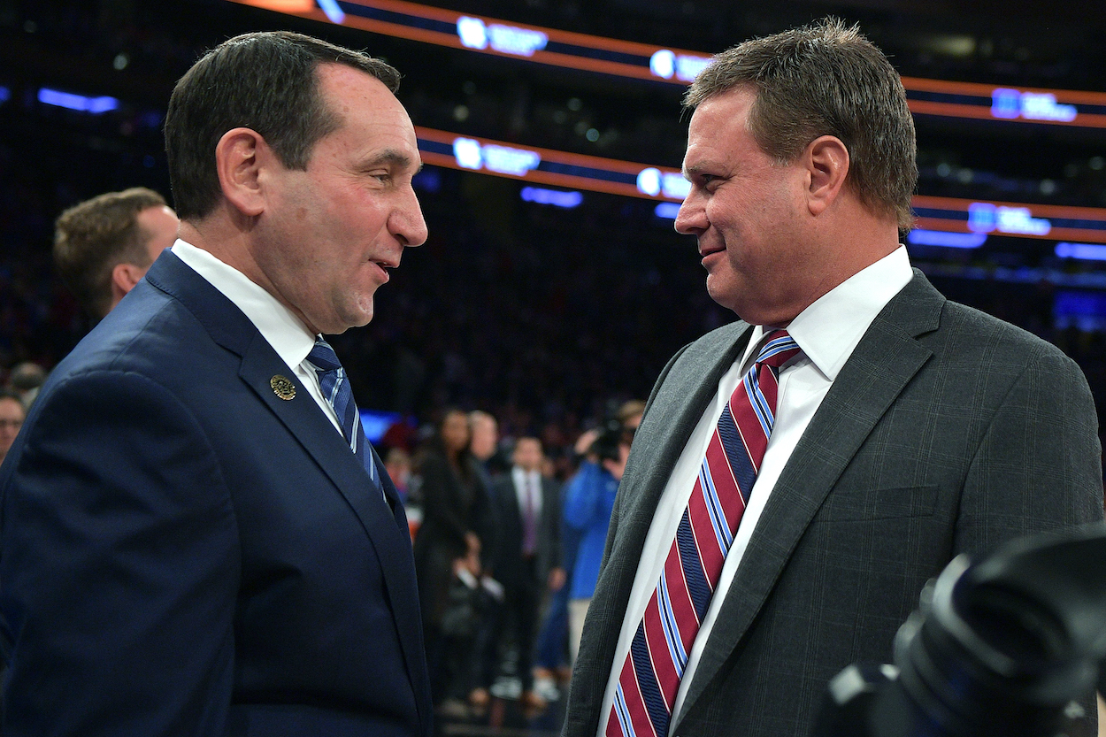 Coach K talks with Bill Self.