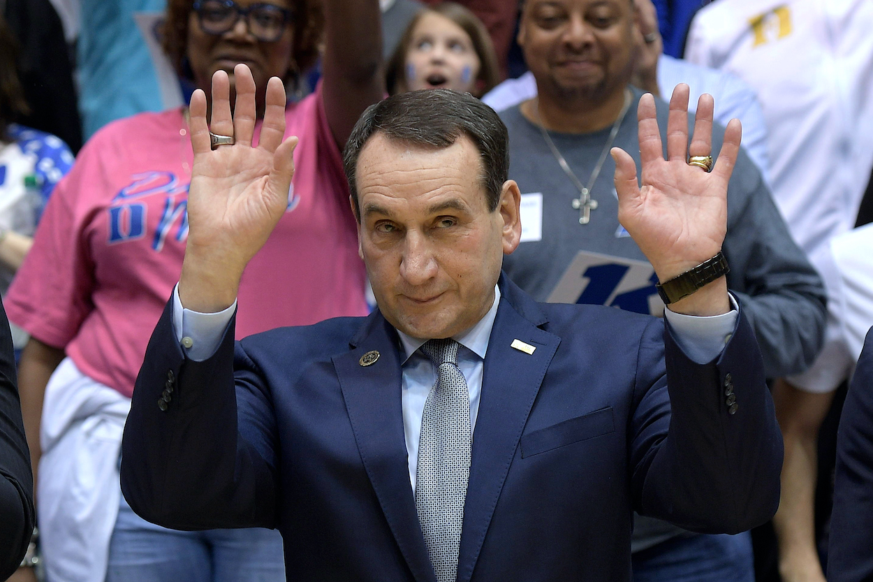 Coach K waves to Duke fans.