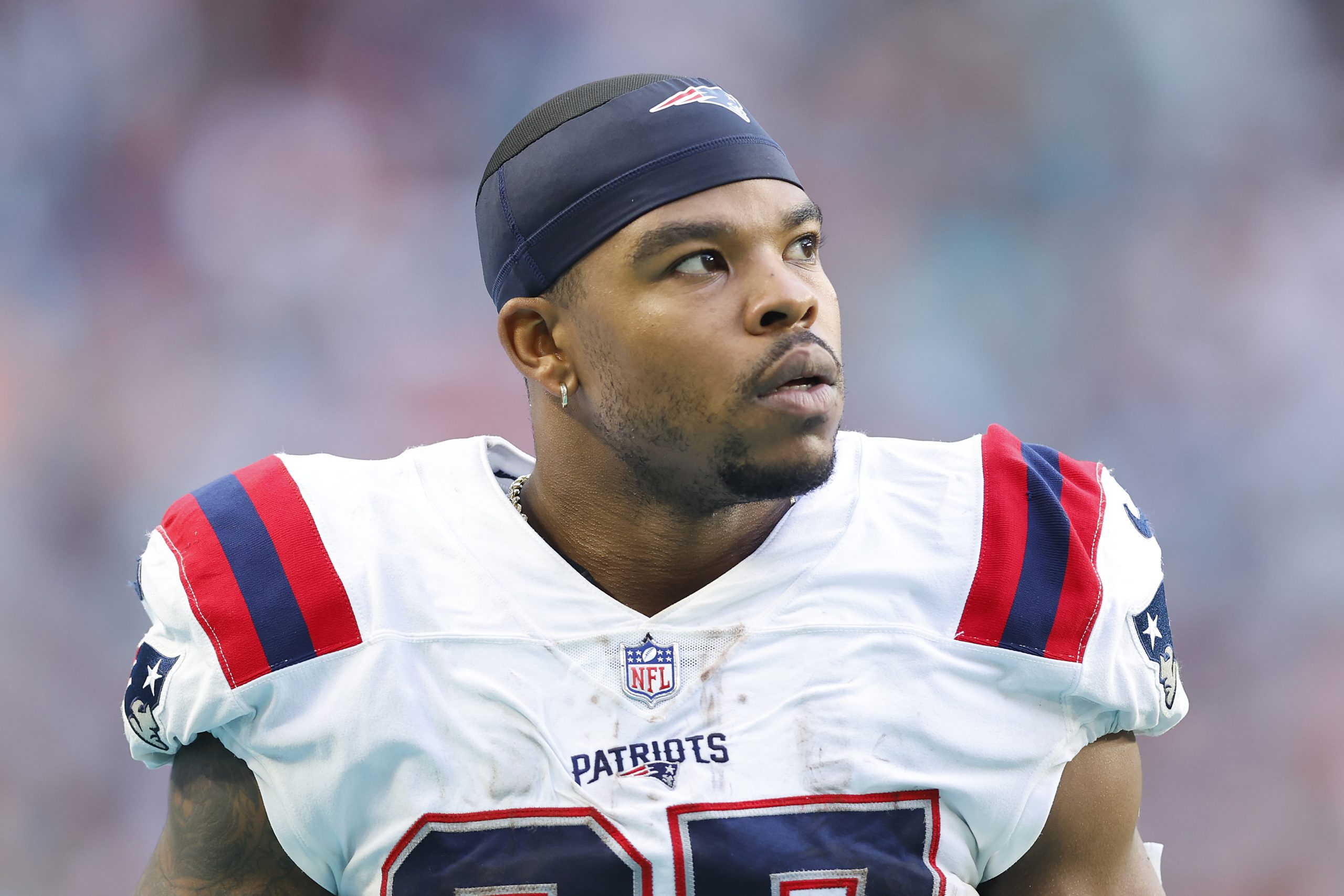 Damien Harris of the New England Patriots looks on against the Miami Dolphins.