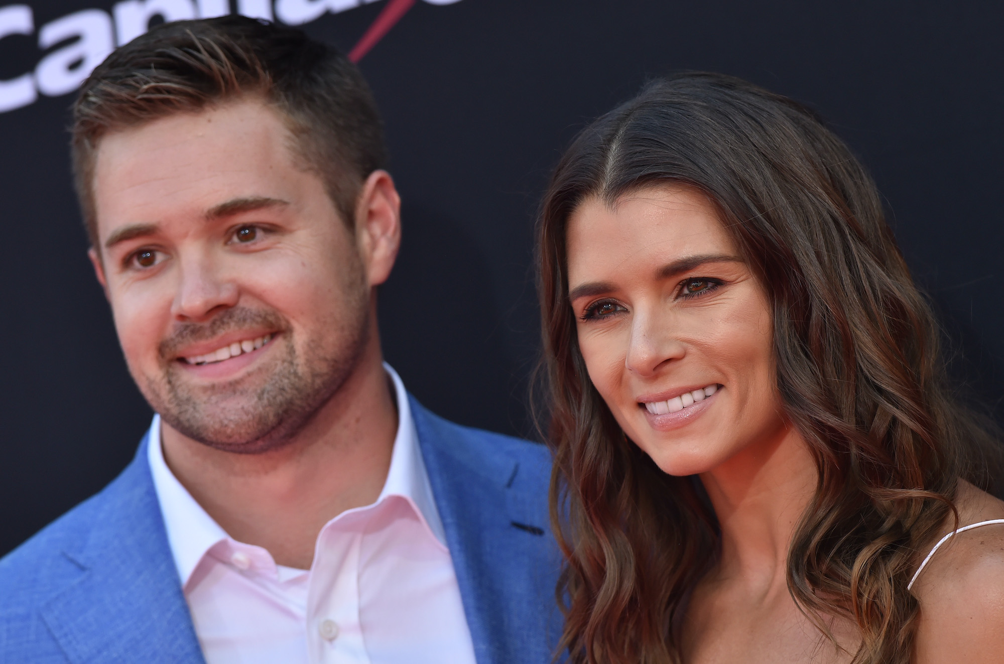 Danica Patrick and Ricky Stenhouse Jr. smile for cameras