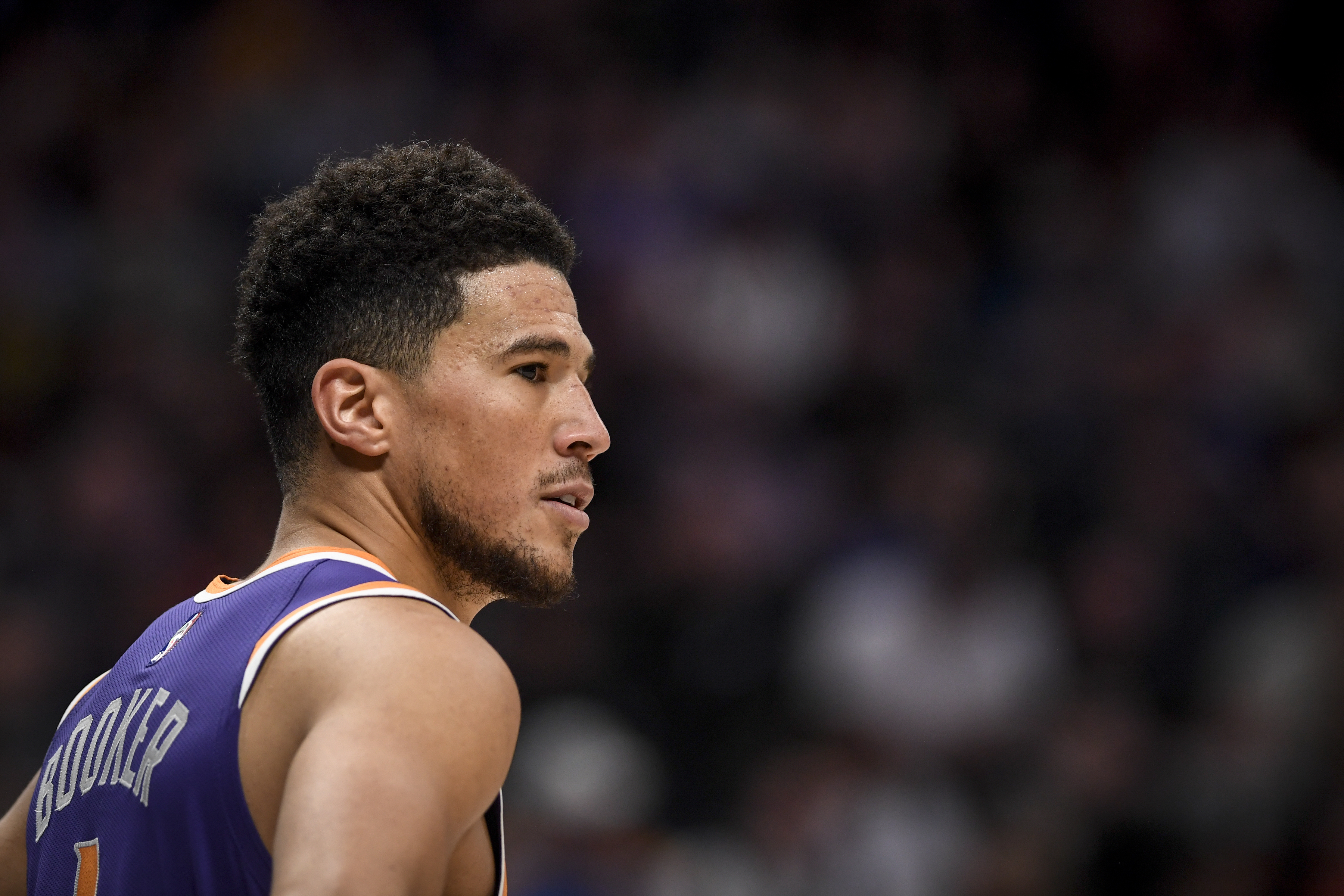 Phoenix Suns guard Devin Booker looks on during a game against the Denver Nuggets