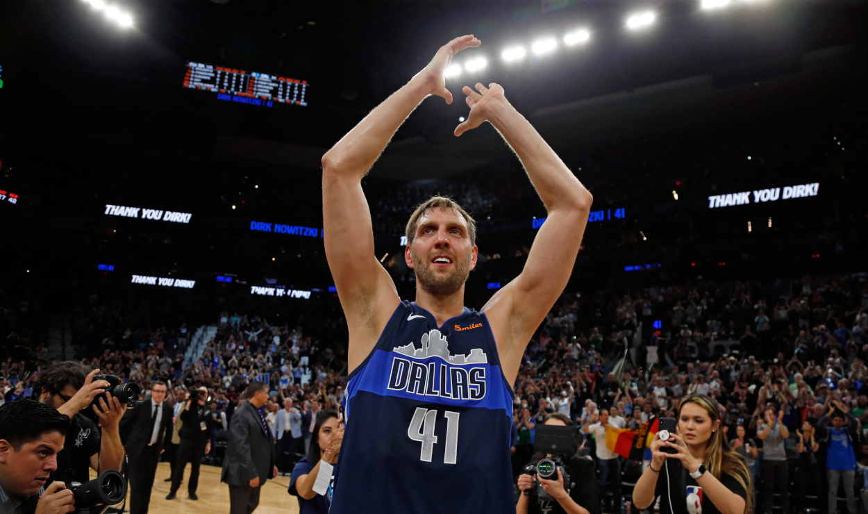 Dirk Nowitzki of the Dallas Mavericks acknowledges fans at the end of his last game.