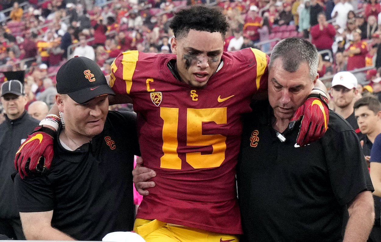 WR Drake London of the USC Trojans is carted off after an injury on a touchdown catch against Arizona. ESPN's Mel Kiper Jr. has London going to the New York Jets in the 2022 NFL Draft.