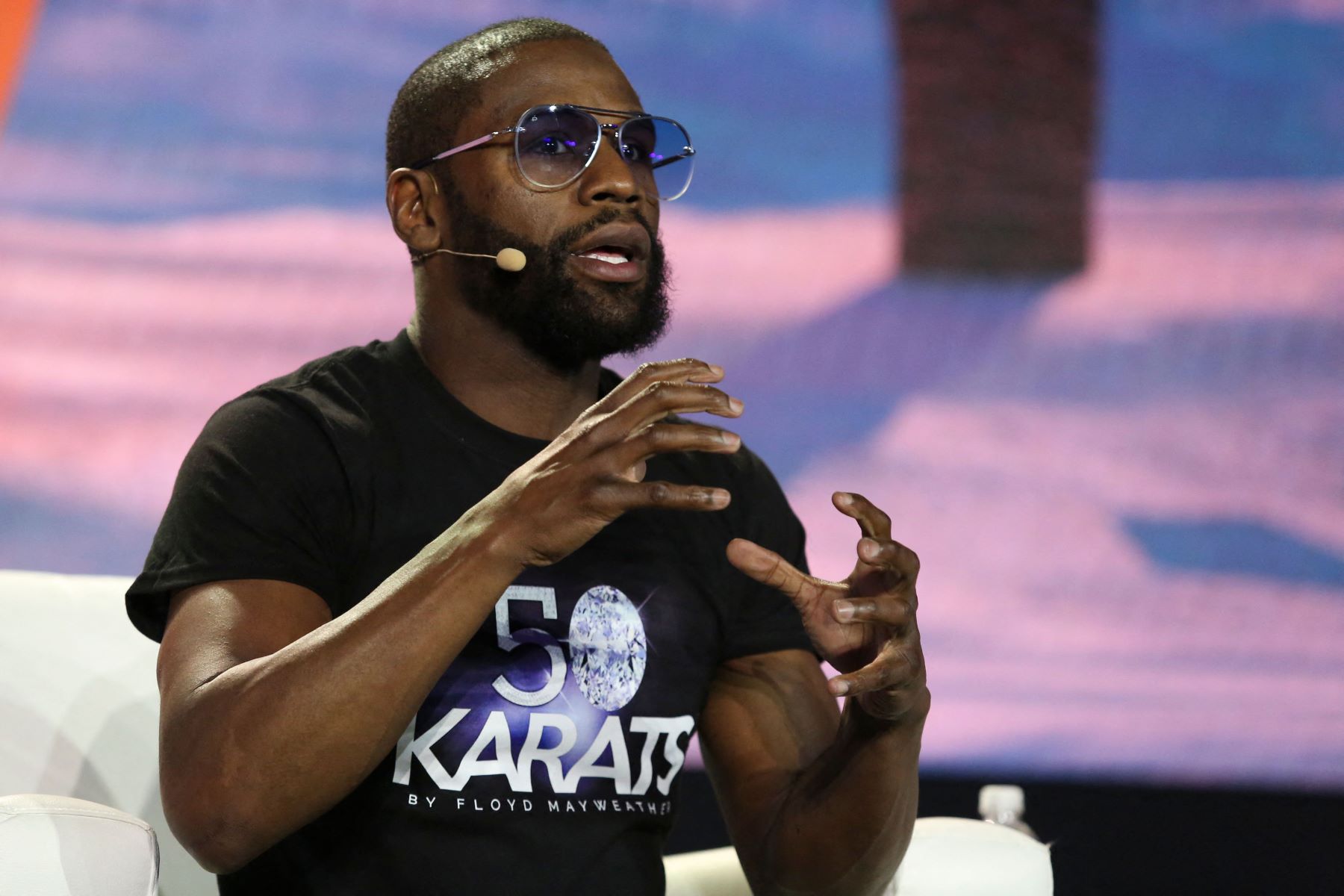 Former world welterweight champion Floy Mayweather speaking at cryptocurrency bitcoin conference