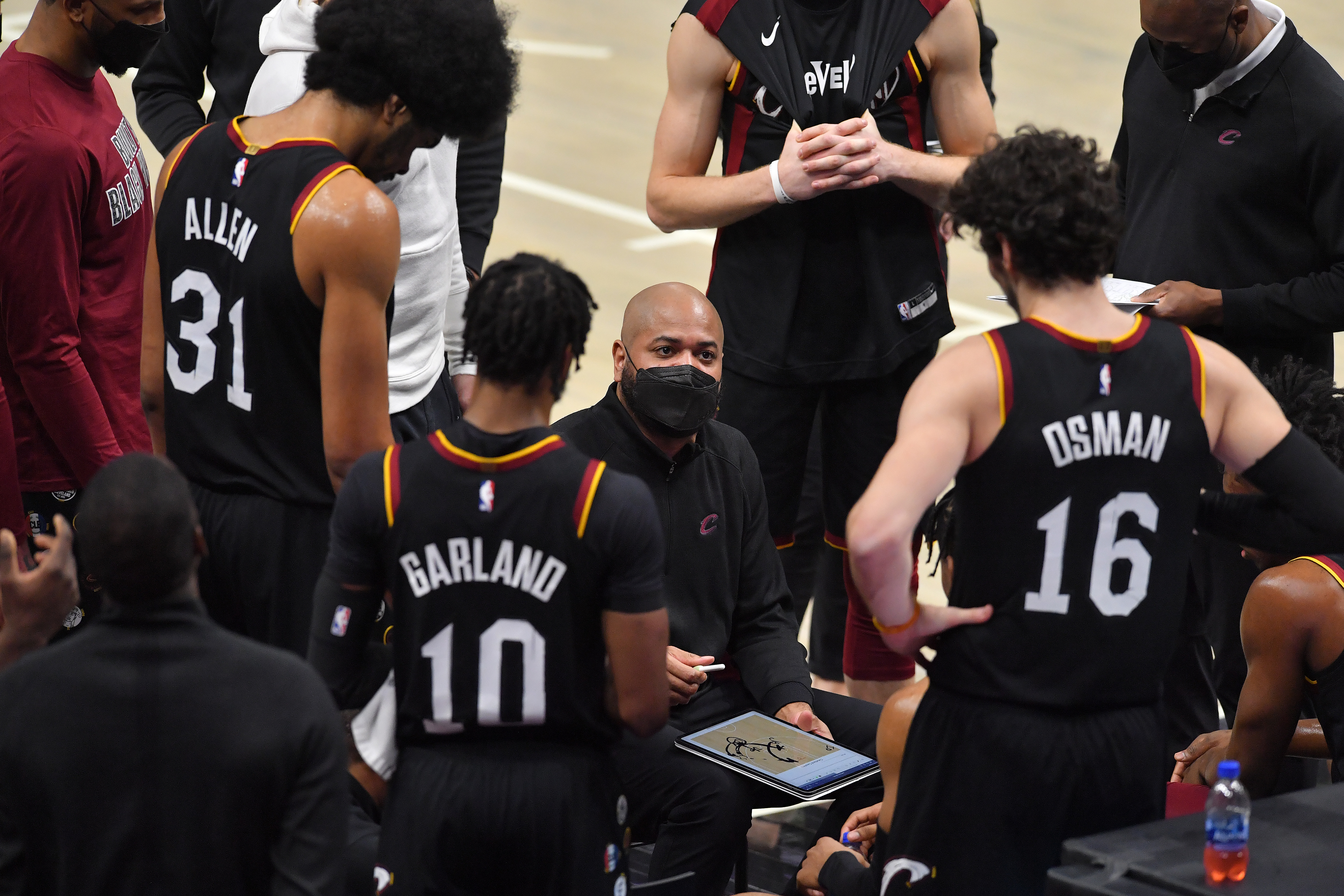 Cavs coach J.B. Bickerstaff with Cedi Osman, Darius Garland, and Jarrett Allen