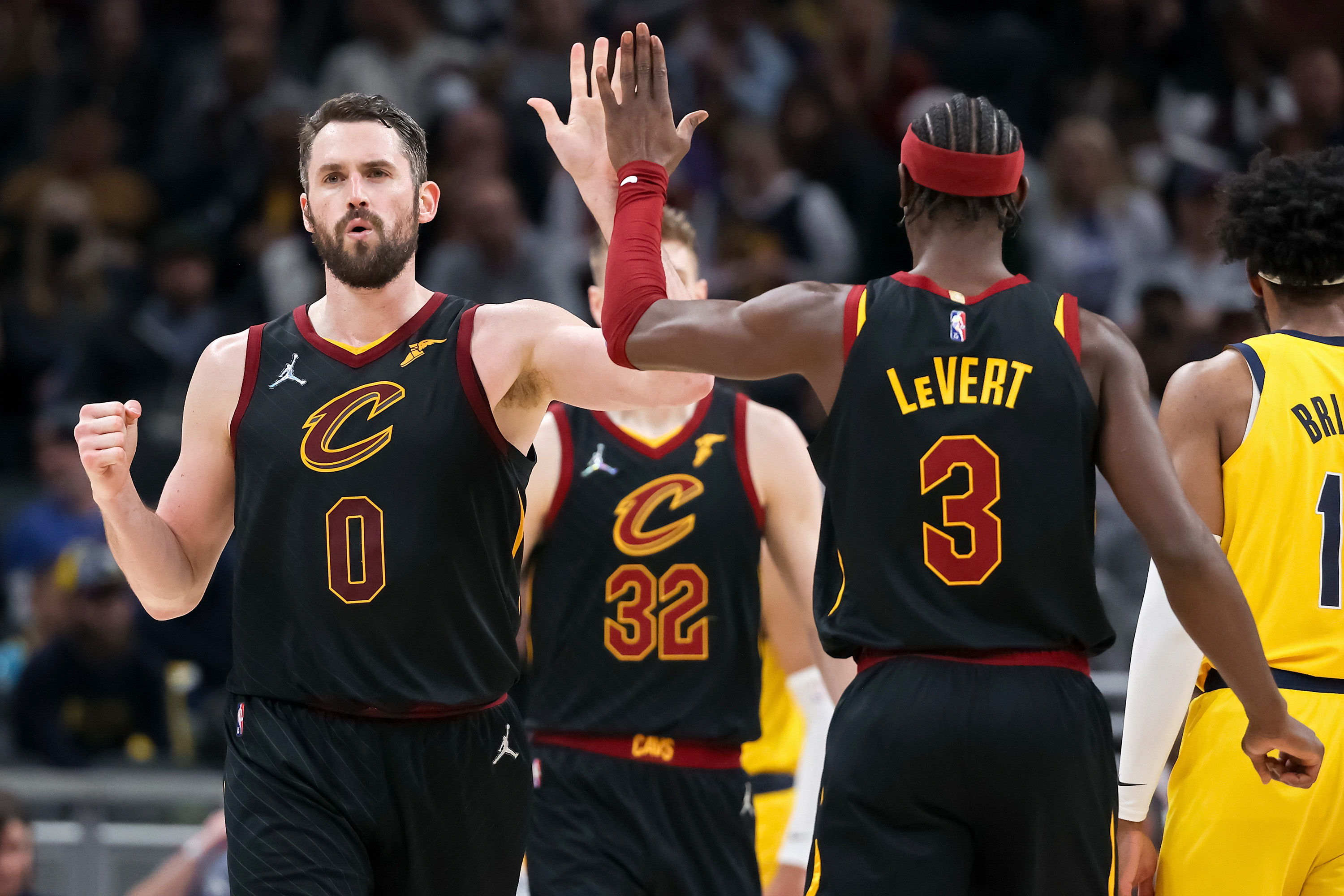 Caris LeVert, Kevin Love of the Cleveland Cavaliers celebrate