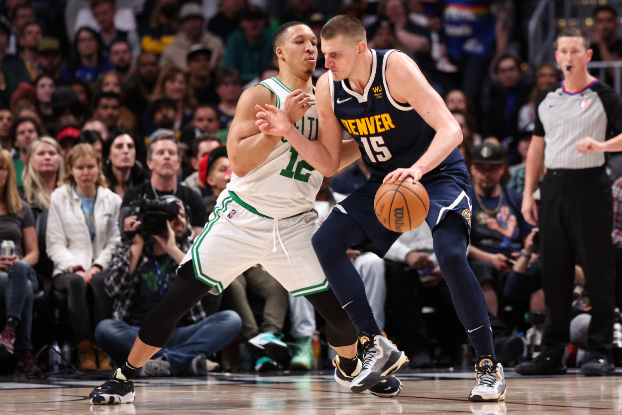 Grant Williams of the Boston Celtics defends Nikola Jokic of the Denver Nuggets.