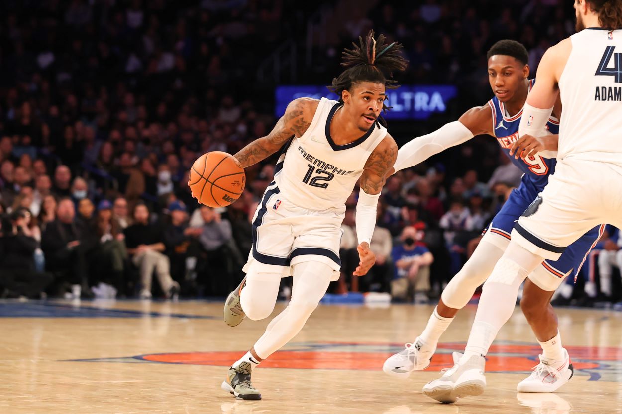 Grizzlies point guard Ja Morant attempts to dribble the ball toward the rim against the Knicks.